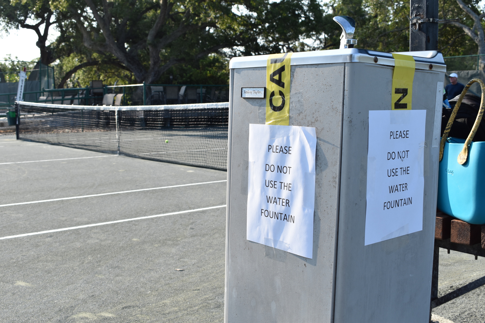 A sign warns members of the Longboat Key Tennis Center not to use the drinking fountains while restrictions are in place because of the COVID-19 pandemic.