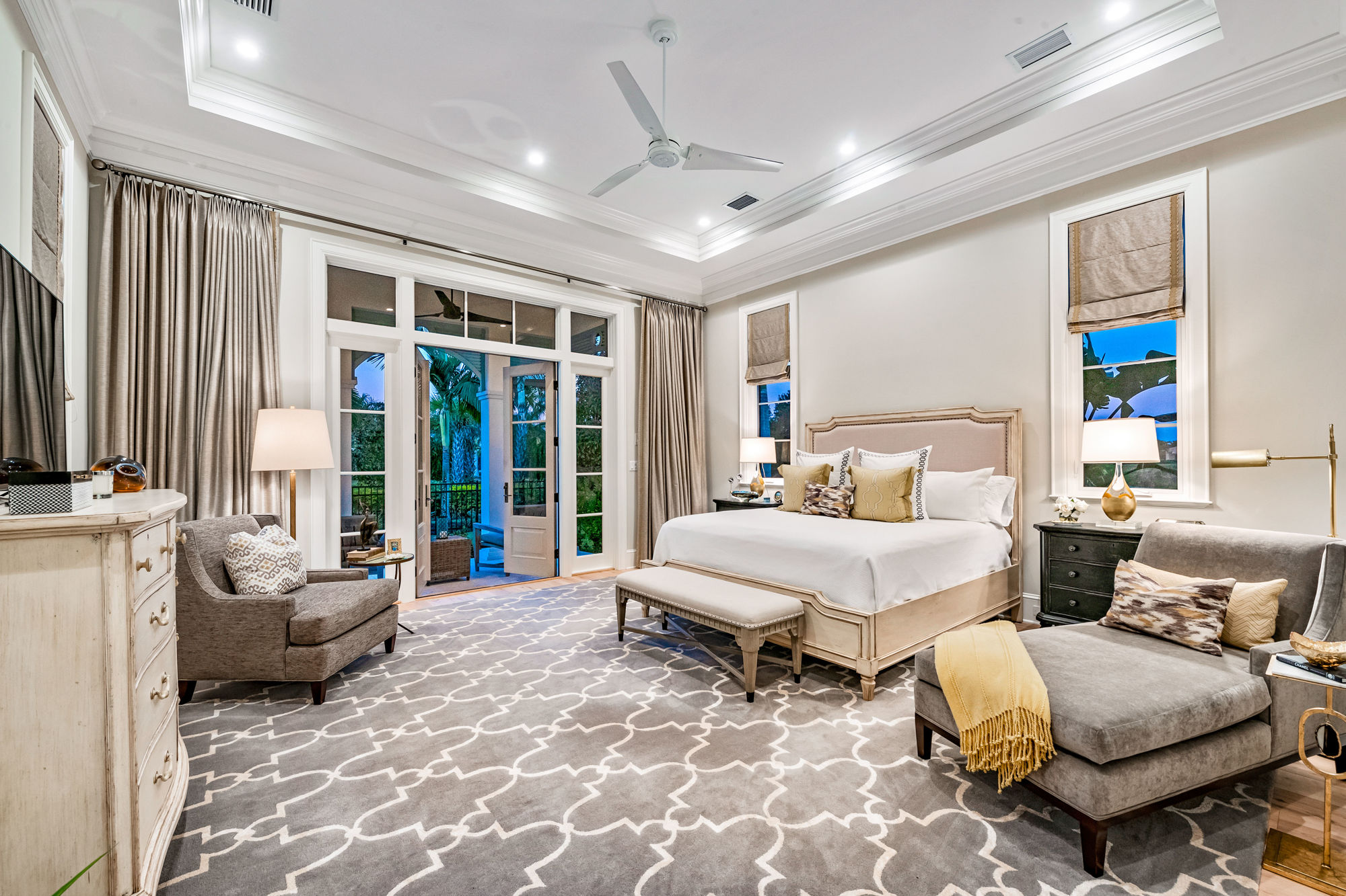 The master bedroom is subdued and elegant. Decorator Holly Dennis worked with the owners to create an atmosphere that merges traditional and contemporary design.
