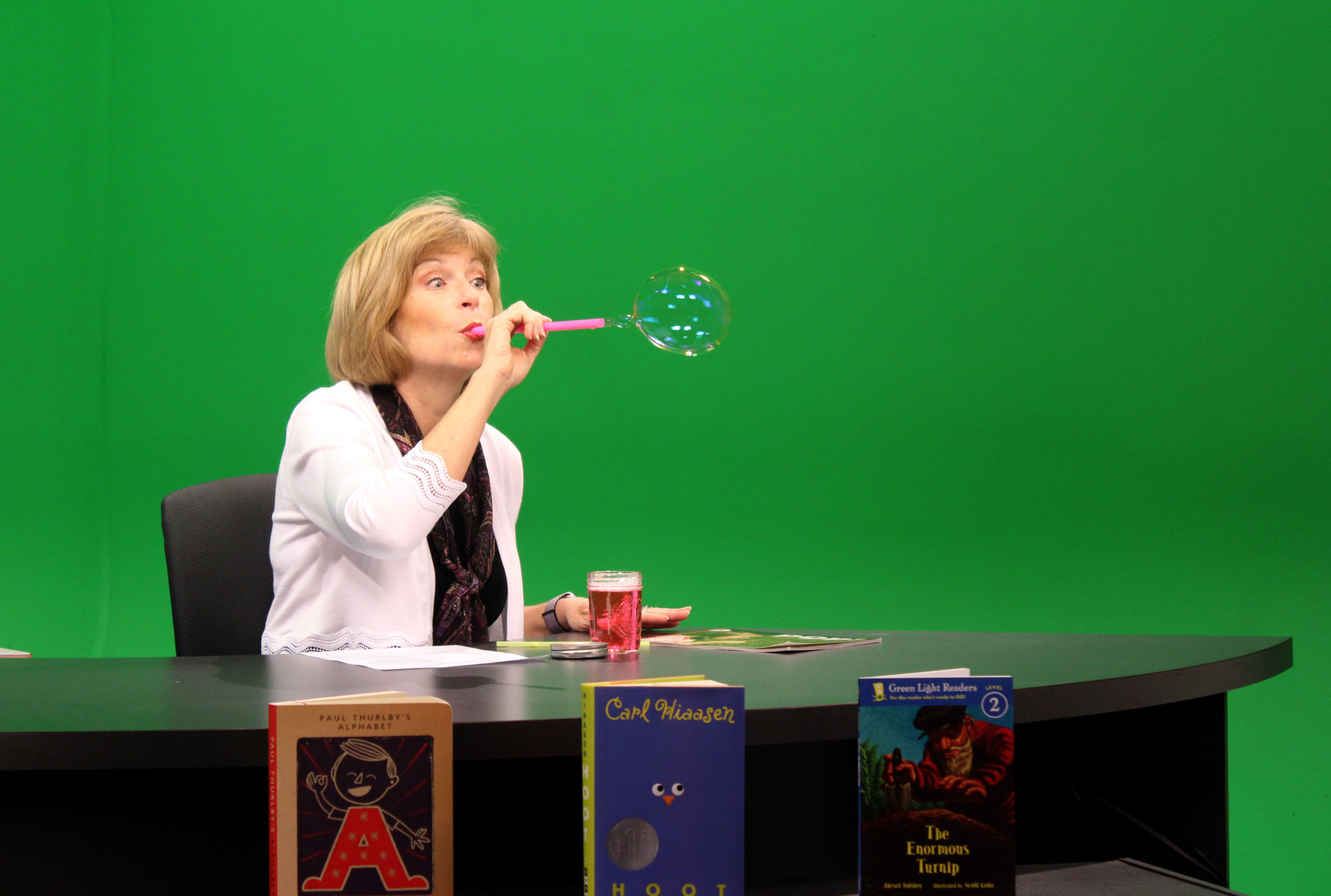 Beth Duda blows bubbles during an activity segment of 