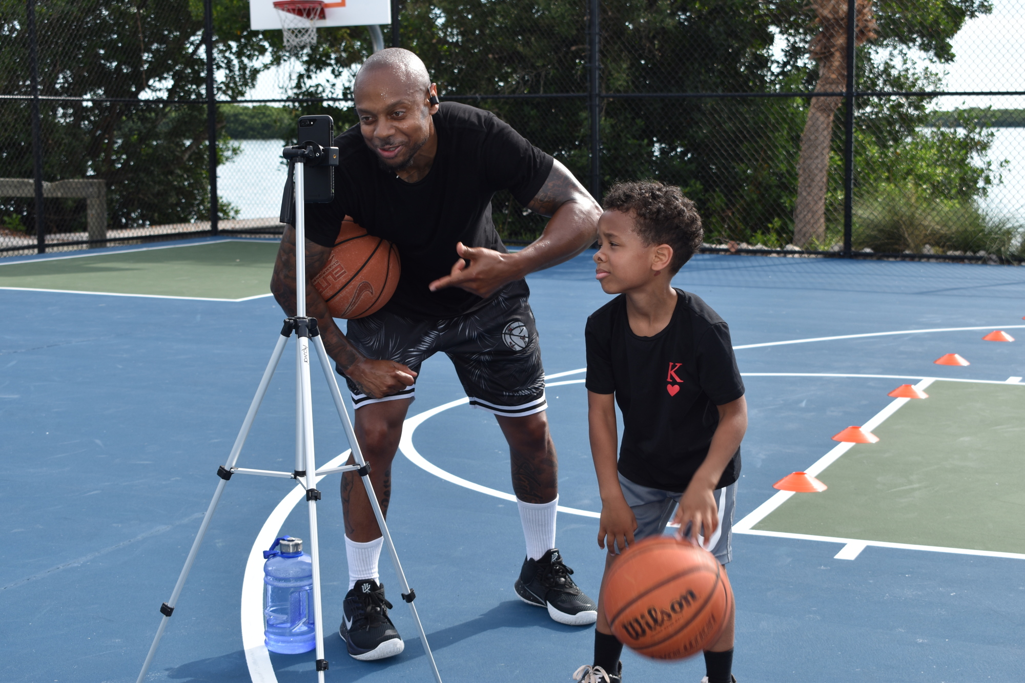 Tim Grant (left) and King Grant (right) communicated with clients in South Korea via Facebook Live on Monday, June 22, 2020, at Bayfront Park.