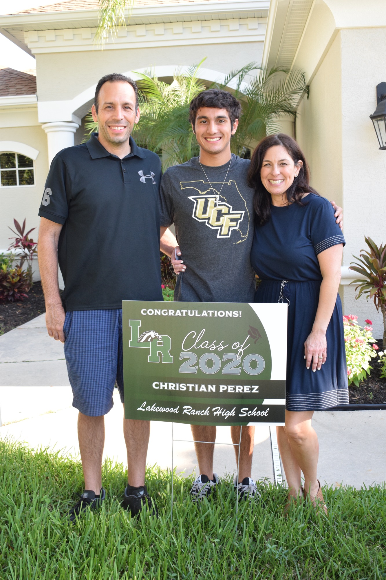 Hugo Perez and Nattaly Perez have been able to spend a few more months with their son Christian (center) before they become empty nesters.