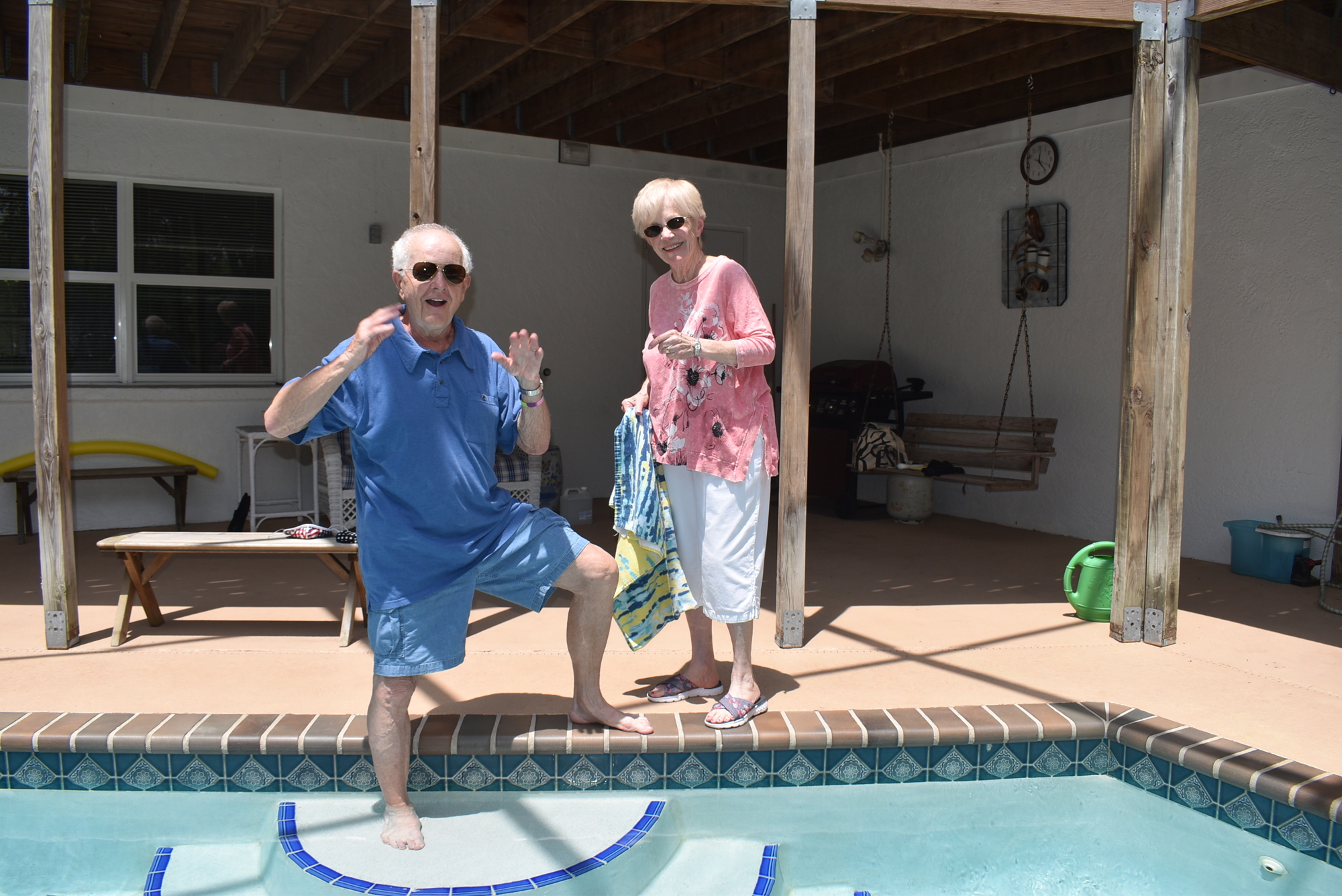 Duane and Karen Compton take advantage of their pool during the hot summer.