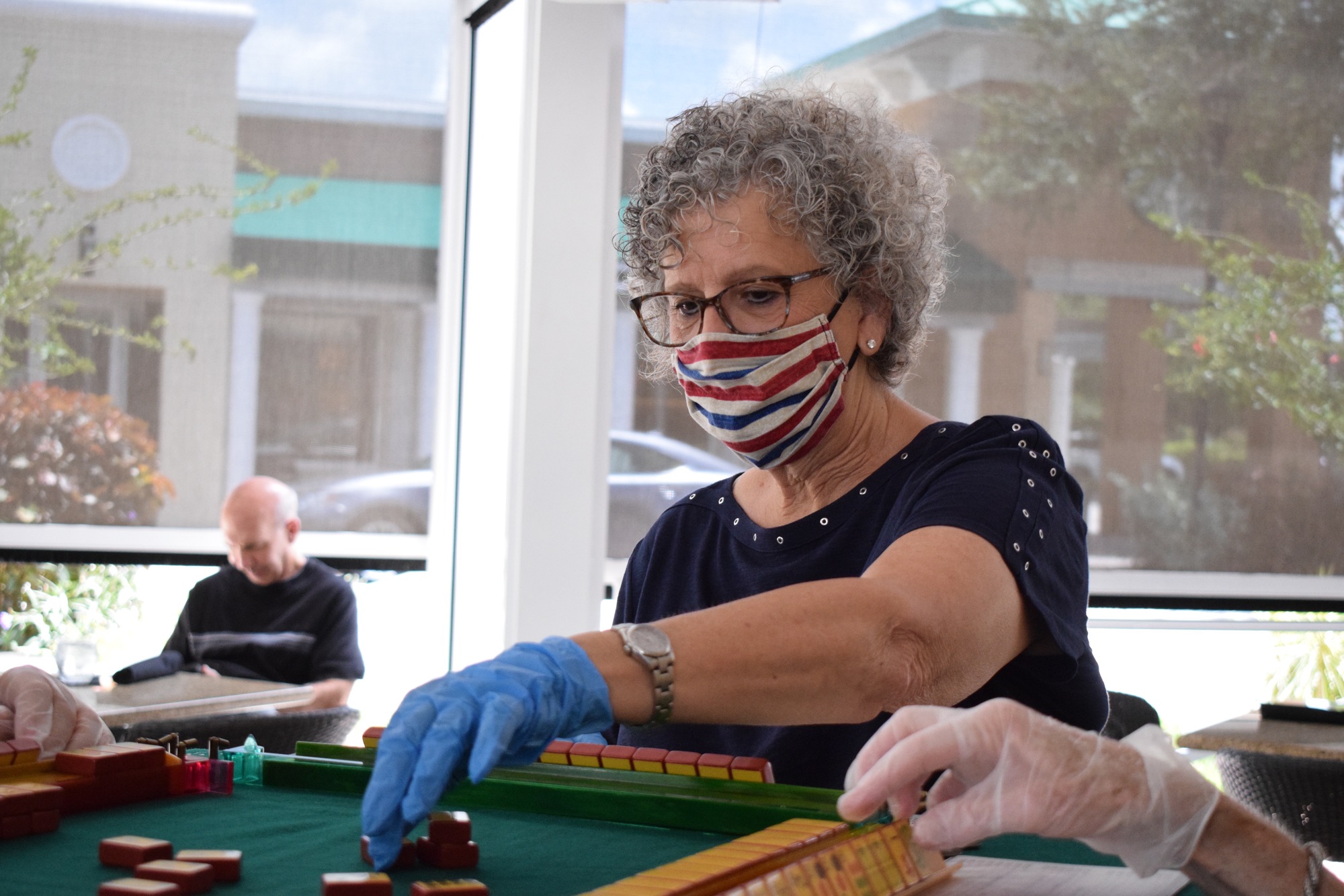 Helene Levin says the mahjong players have become a support group to help each other during trying times. The group stopped meeting in person for three months due to COVID-19 but now meet at the Grove to support local businesses.
