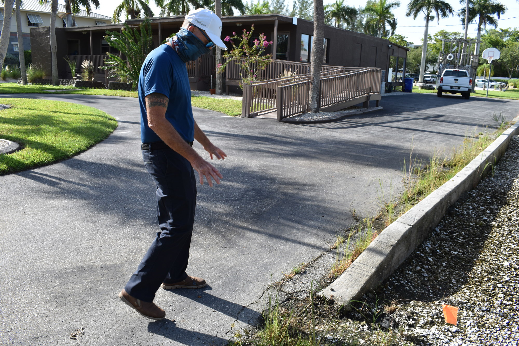 Ross Toussaint showed the impacts on his driveway when stormwater runoff overflows from the bioswale.