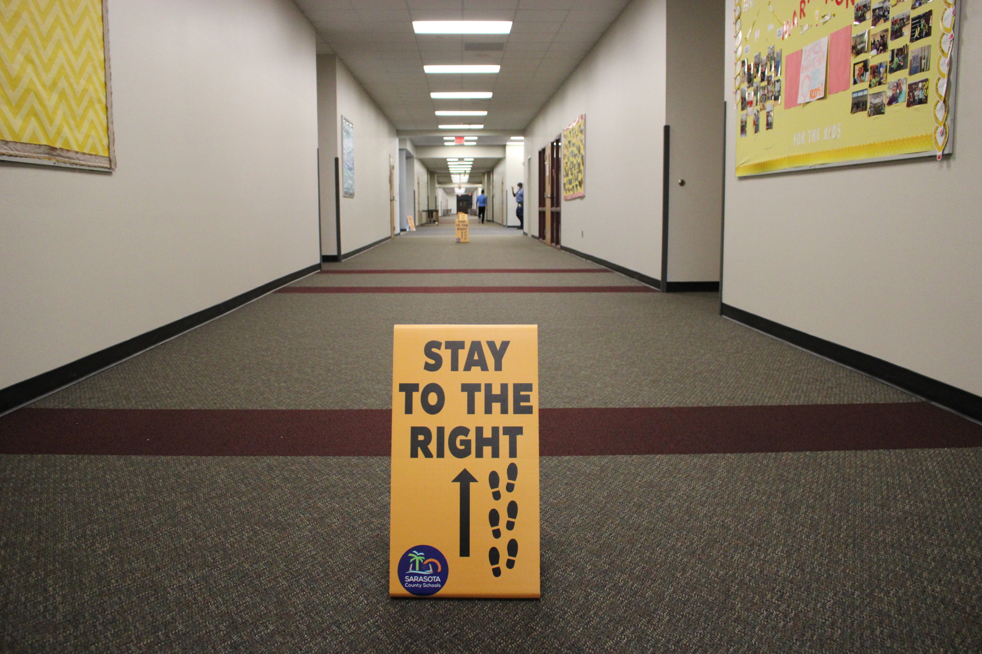 Signs are posted throughout the hallways to help control the flow of traffic. Photo courtesy of Sarasota County Schools
