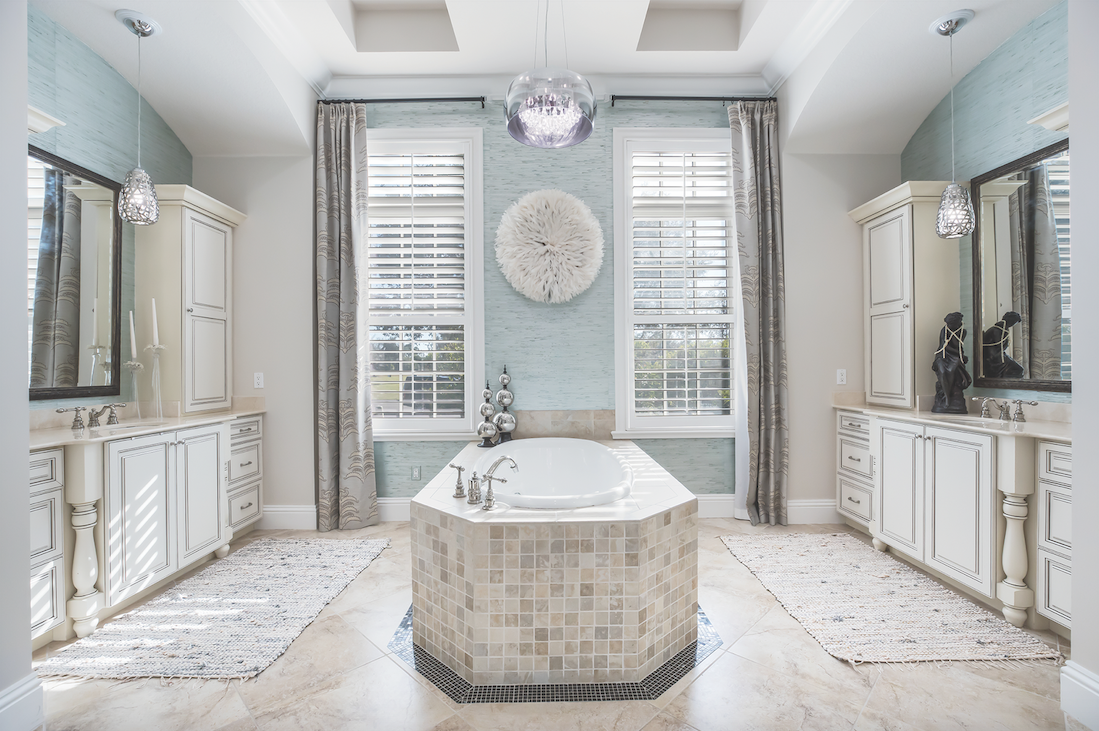 A stand-alone tub in the sunny master bath offers a spa-like atmosphere.