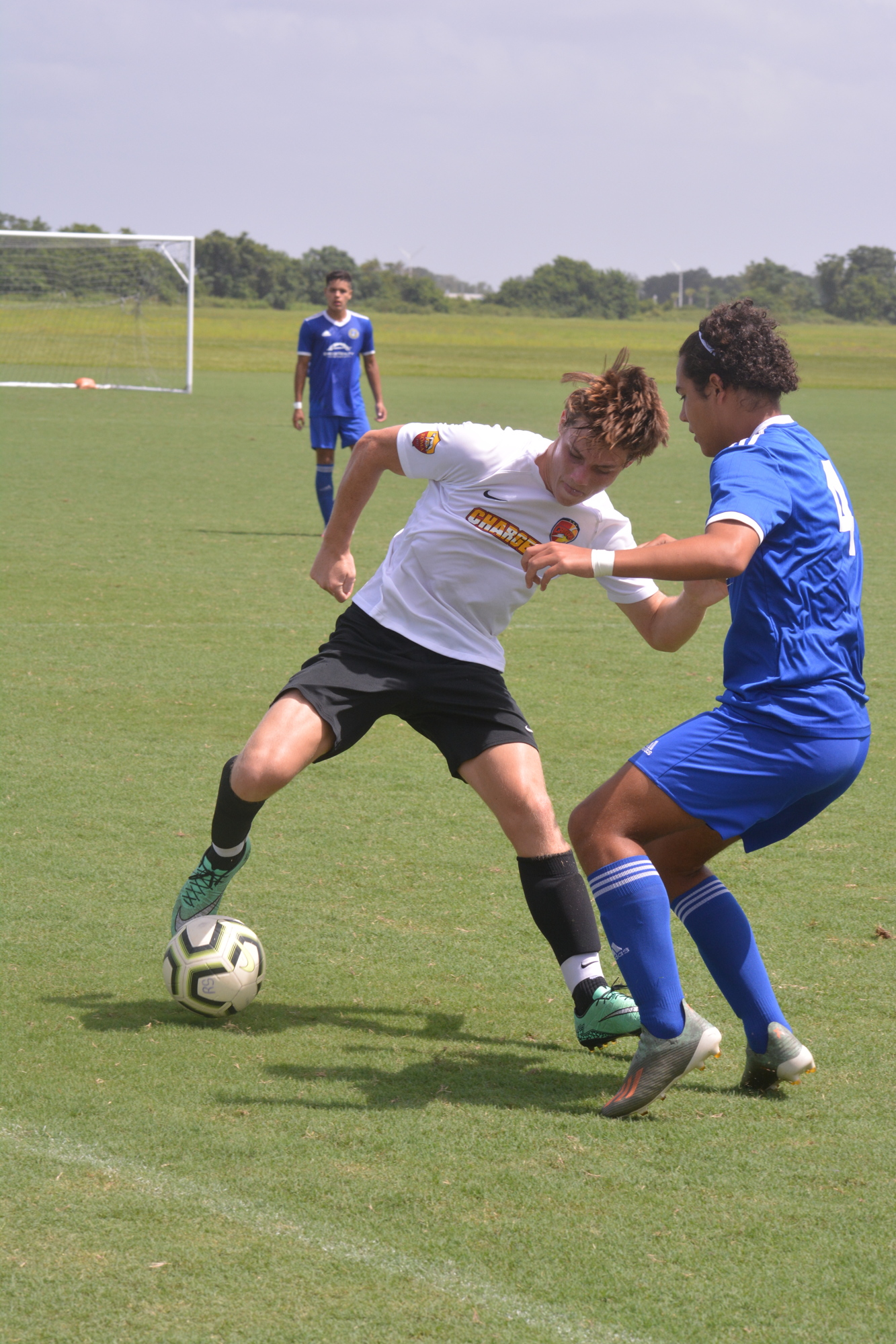 Boys U19 Clearwater Chargers midfielder Jack Righter  defends the ball during a match against Hunter's Creek SC (Orlando). Photo by Ryan Kohn.