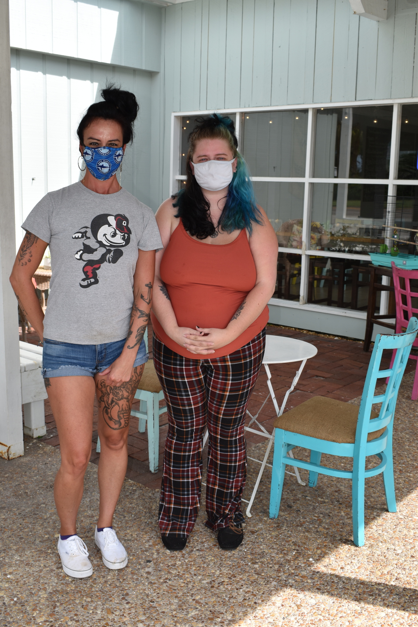 Turtle Coffee Bar owner Heather Gaus (left) and worker Tierra Garwood (right) said they've had to tell beachgoers they cannot park in the establishment's private parking lot.