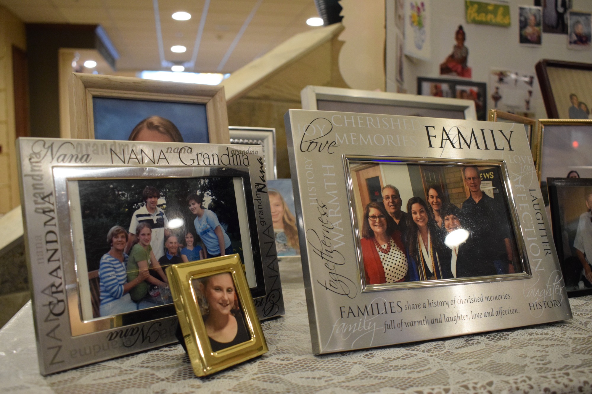 Family photos are on display at Stone River Retirement Community to celebrate National Grandparents Day since children under 18 years old aren't allowed to visit yet.