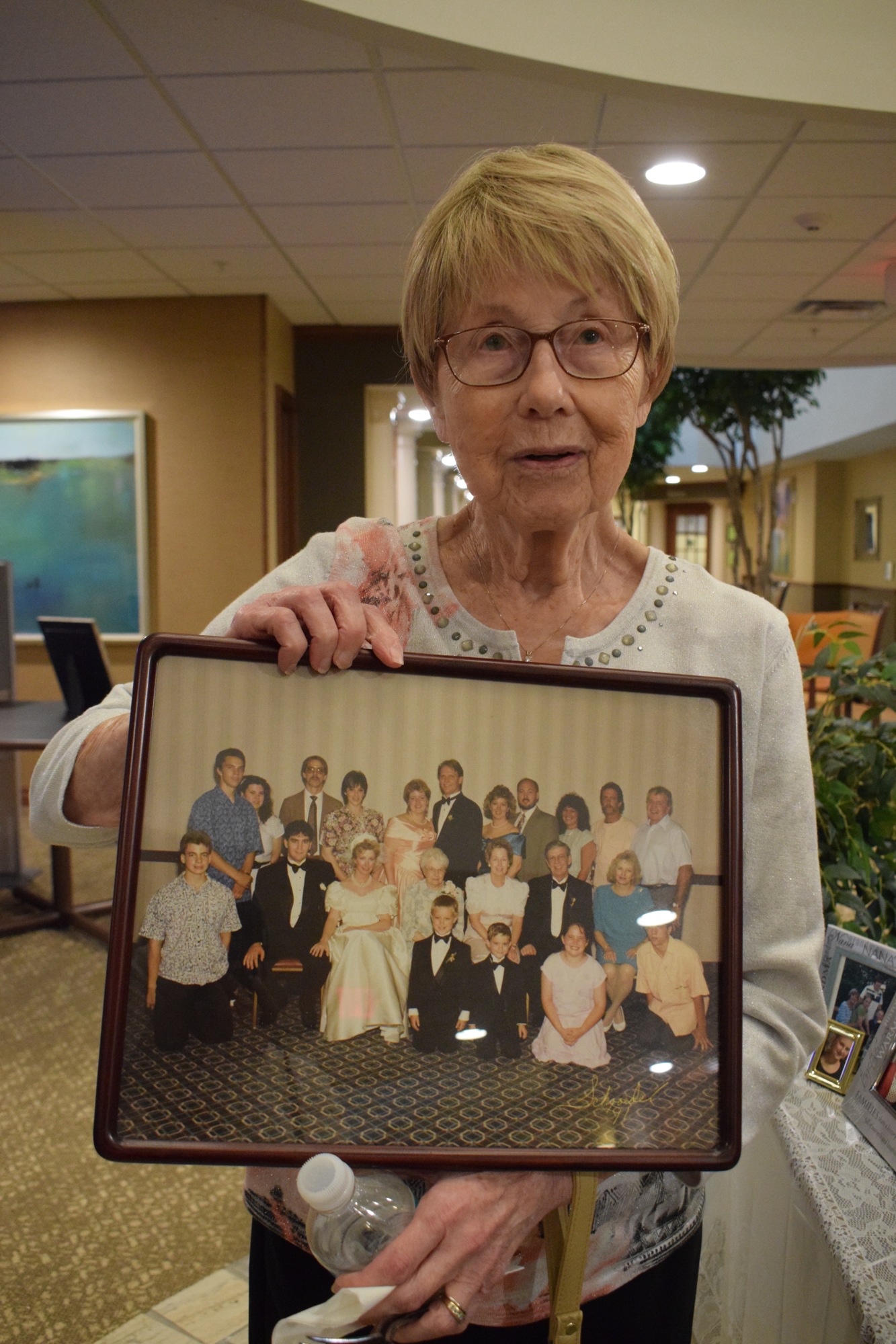Joanne Warmar, a resident at Stone River Retirement Community, shows a photo of her family. She has Five children, nine grandchildren, 10 great-grandchildren and two great-great grandchildren.