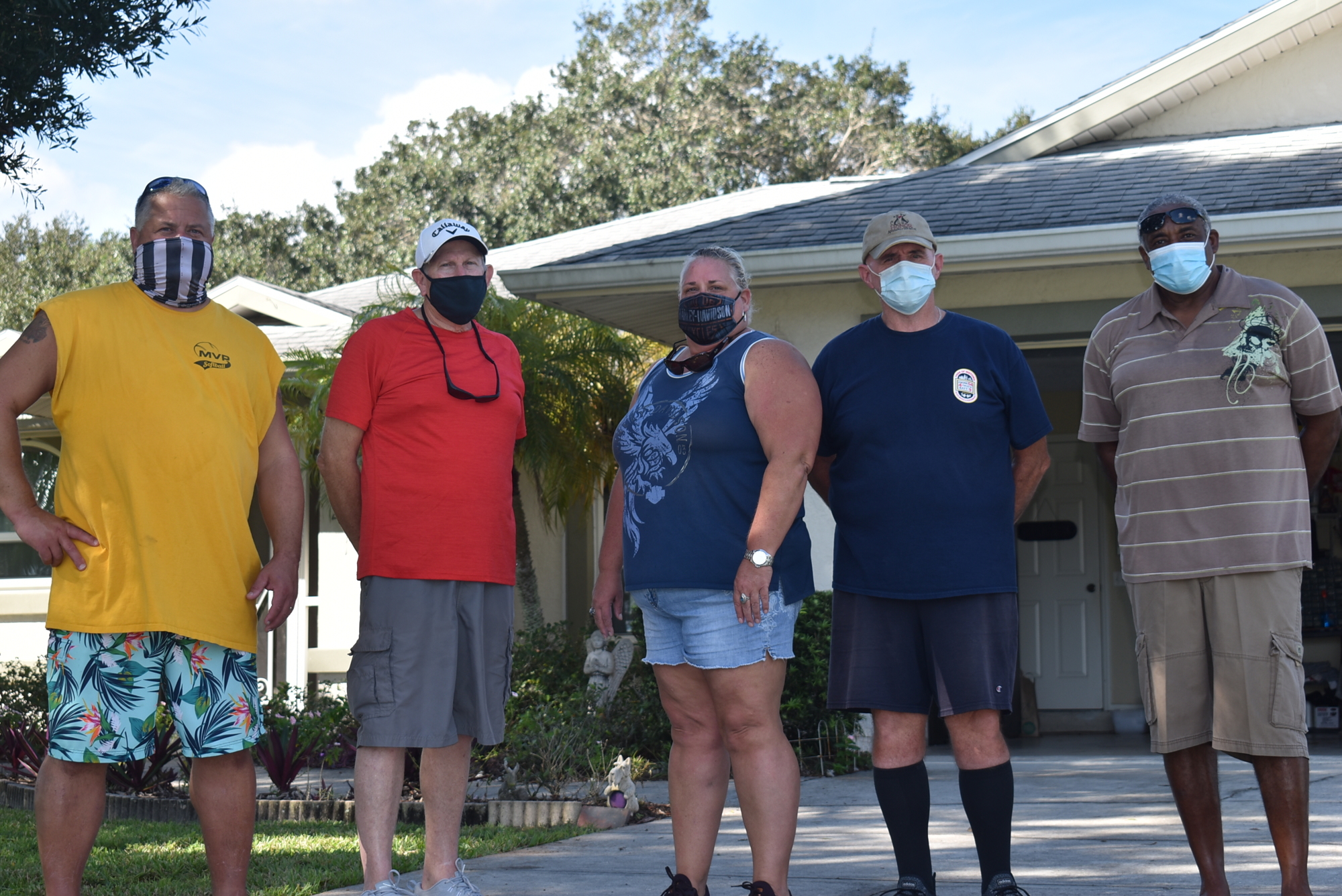 (From left) Windsong Acres residents Daryl Haworth, Arlan Cummings, Robin Hankinson, Howard Duff and Bennie Bundrage are worried the dealership will decrease their home value and increase flooding, among other concerns.