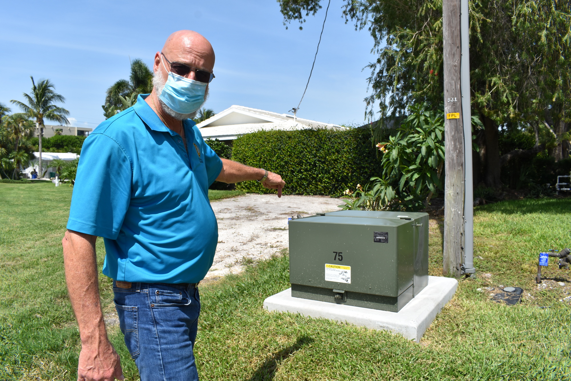 Longboat Key project manager James Linkogle demonstrates how homes in the Country Club Shores IV North neighborhood will use the undergrounding work for utilities. Eventually, FPL will remove its poles throughout the town.