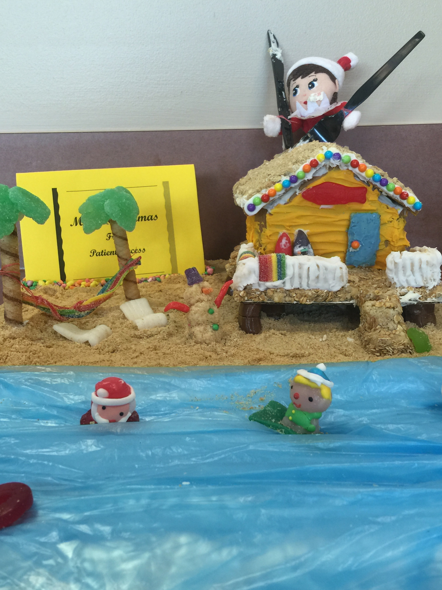 Patient Access designers Robin Weaver and Lisa Wilkes designed a beach scene with an Elf on a Shelf digging into a cottage. The two-woman team won first place.
