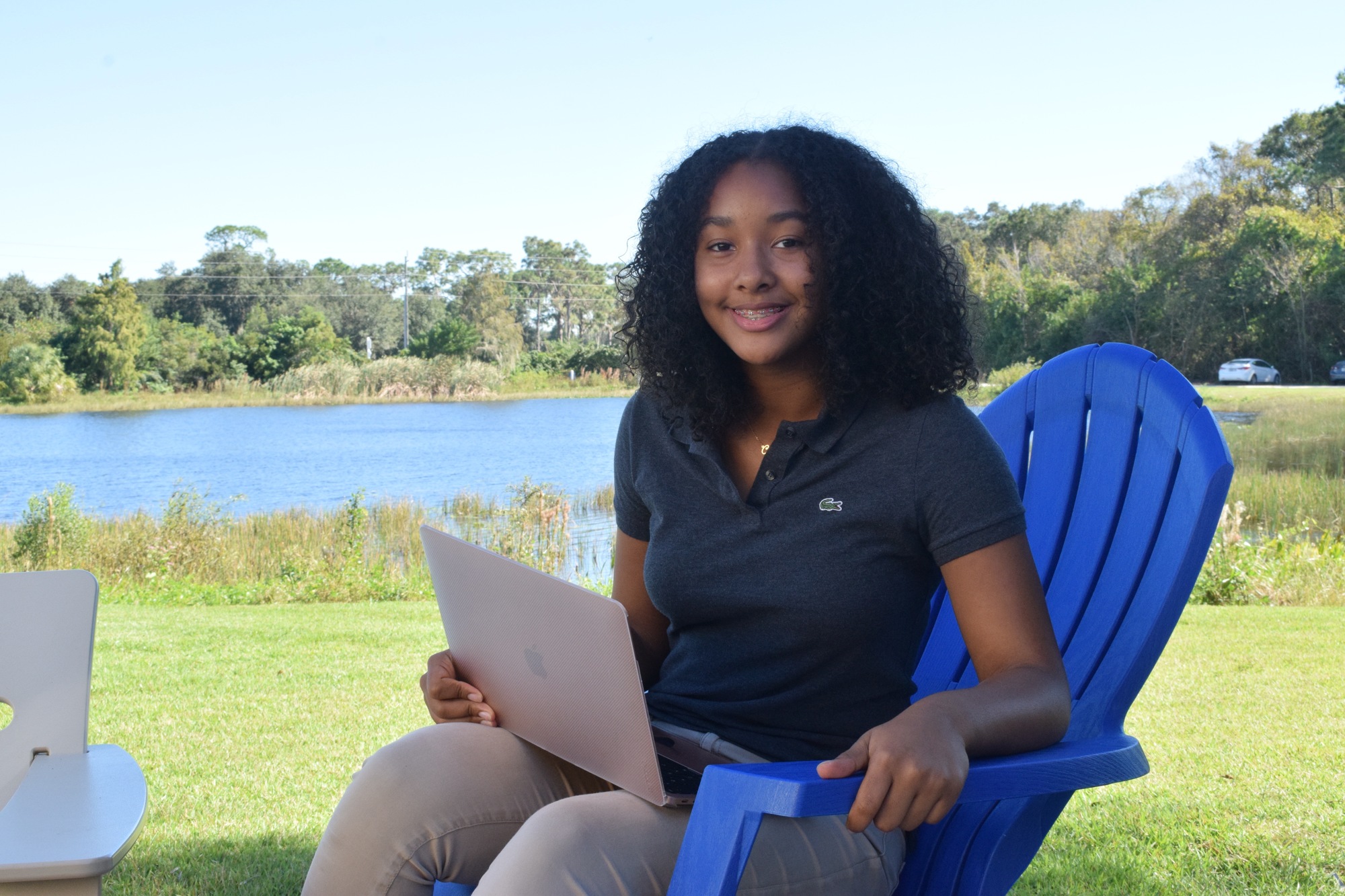 Ciniya Moore, a freshman, works outside by the lake because of the scenery and peacefulness.