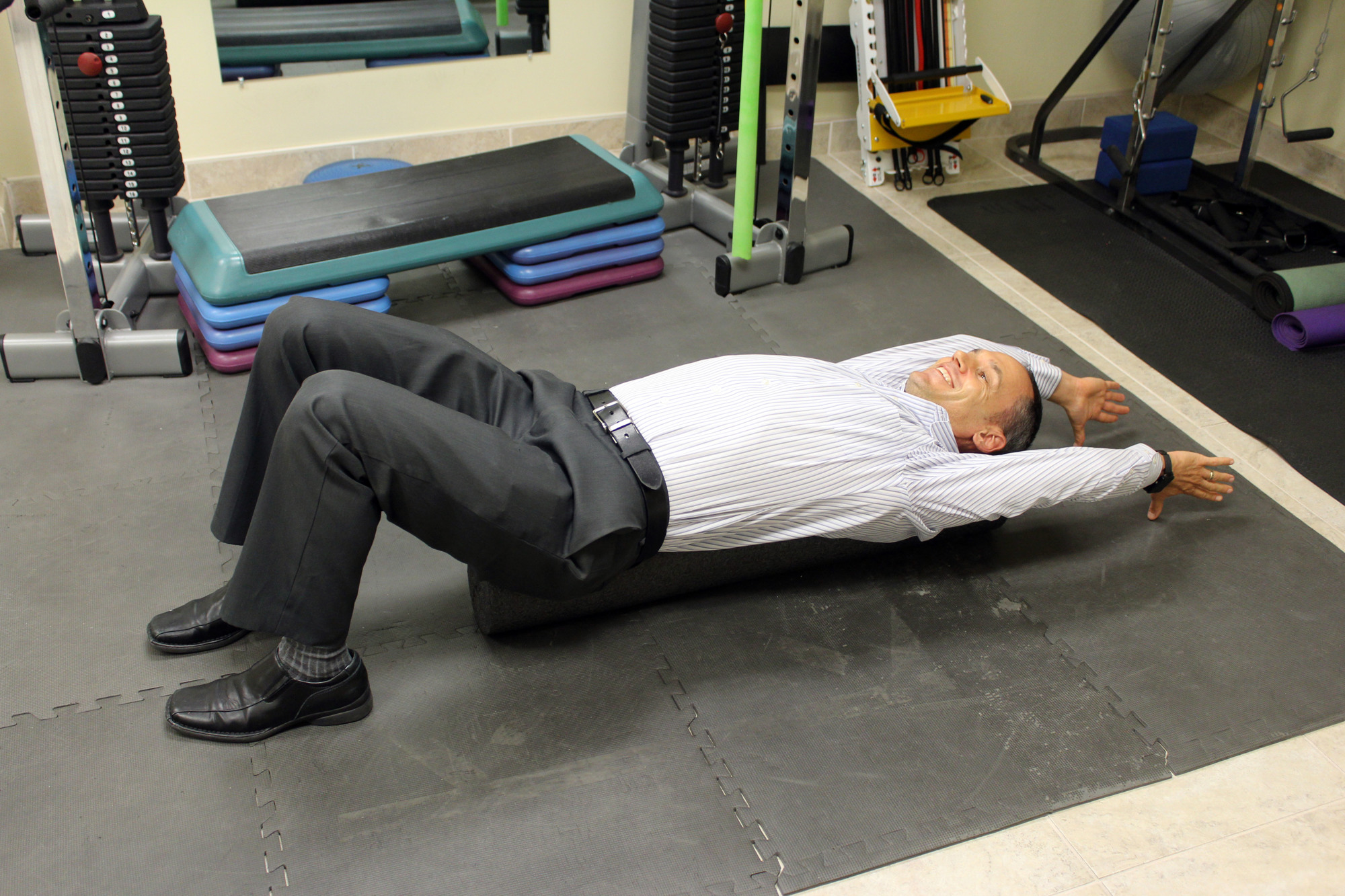 Lying on a foam roller or rolled towl can help improve posture.