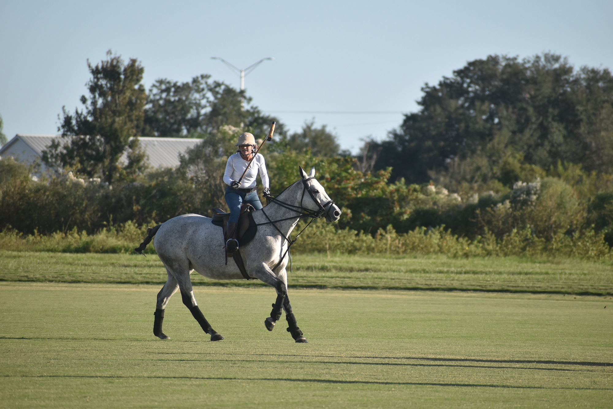 Jaymie Klauber plays polo on 7-year-old Chloe. It was the first practice and scrimmage of the new season.