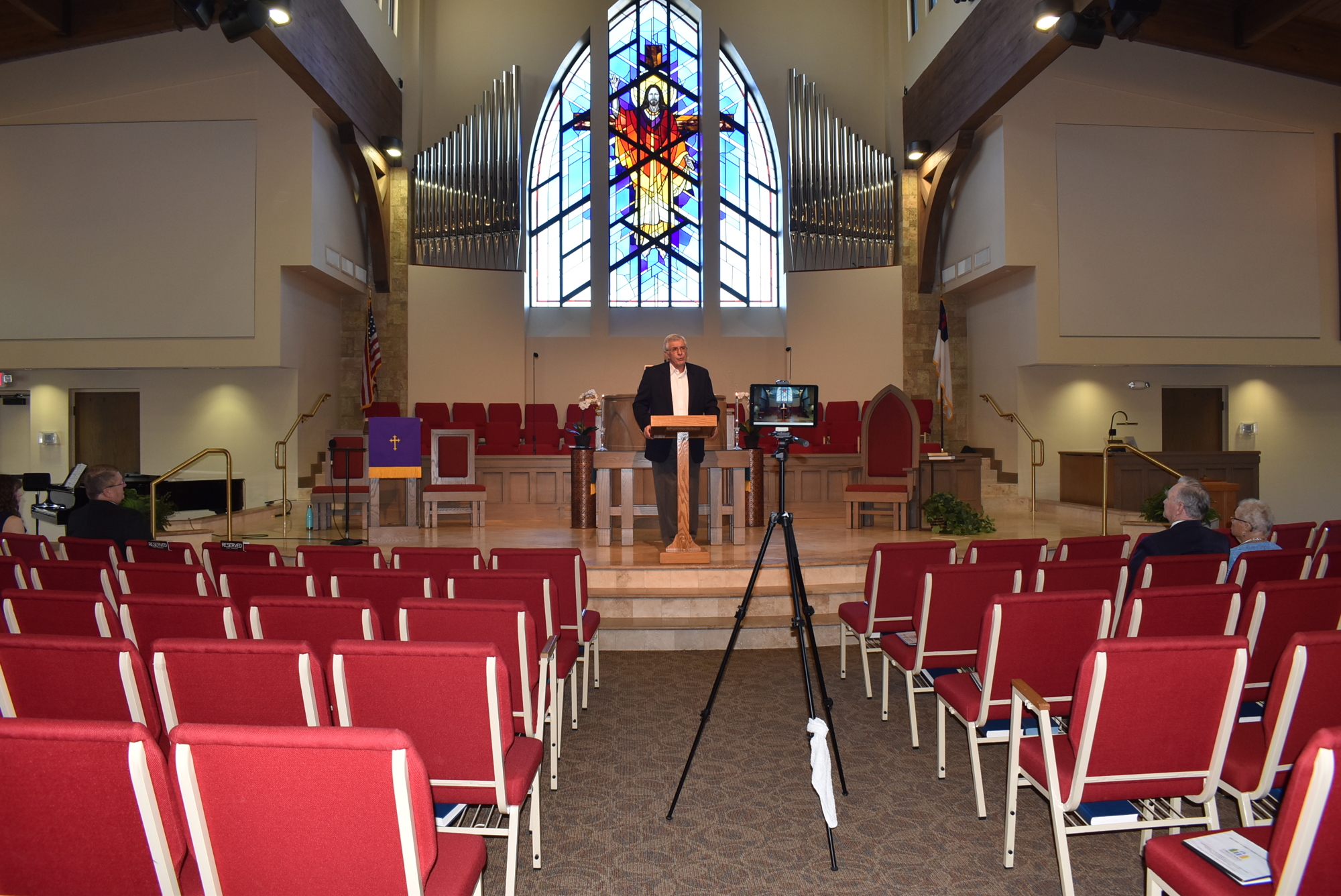 March 19: The Rev. Norman Prichard preaches to the camera and a few churchgoers at Christ Church of Longboat Key.