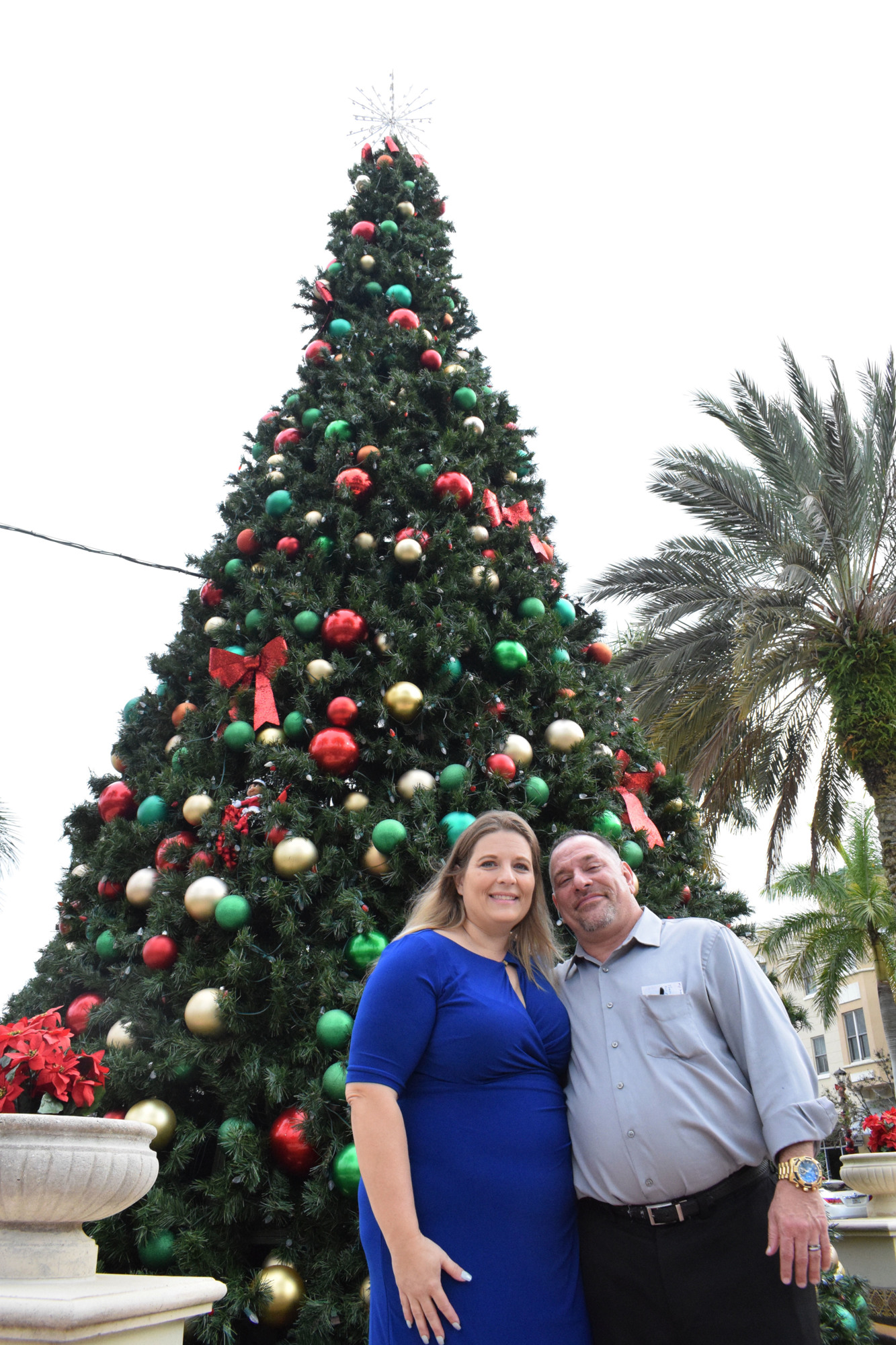 The Christmas tree on Main Street at Lakewood Ranch provides a beautiful place for Greenbrook's Crystal Avery and Marty Satz to have a small intimate wedding.