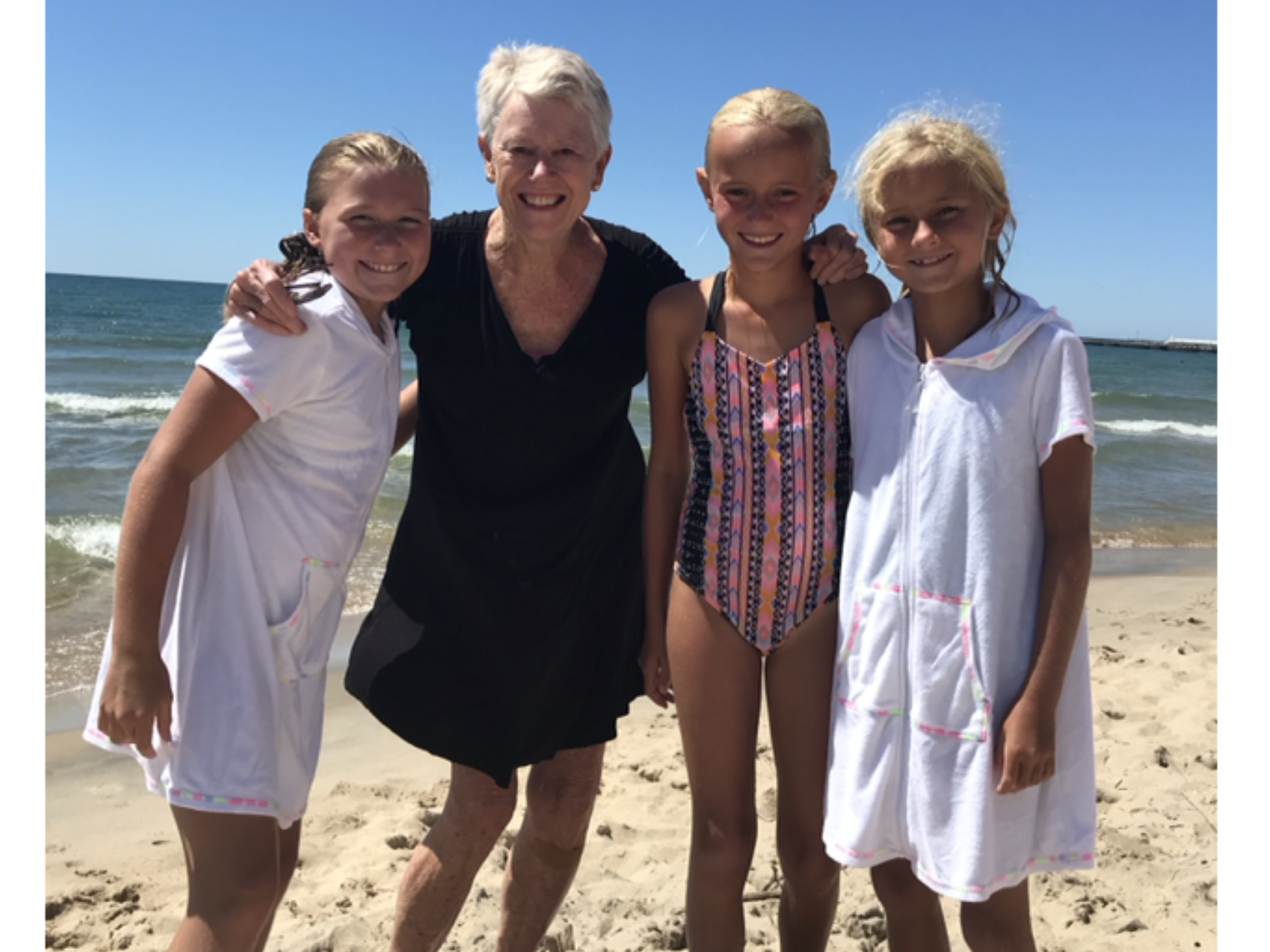 Mary Baker with her granddaughters on Longboat Key during a warm Christmas past.