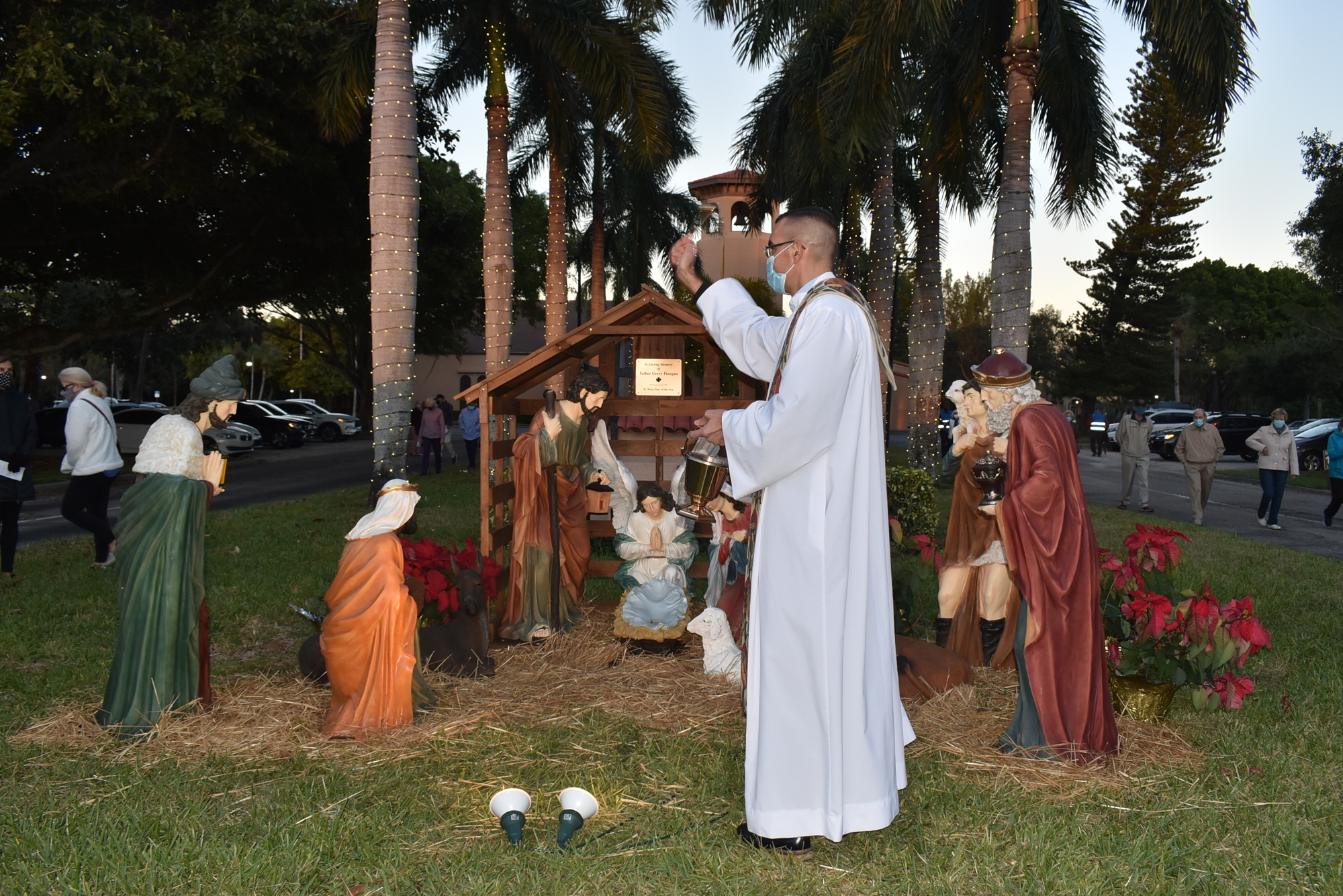 Father Robert Dziedziak blesses the new nativity scene on Dec. 8. The scene was dedicated to his late predecessor, Monsignor Gerry Finegan.
