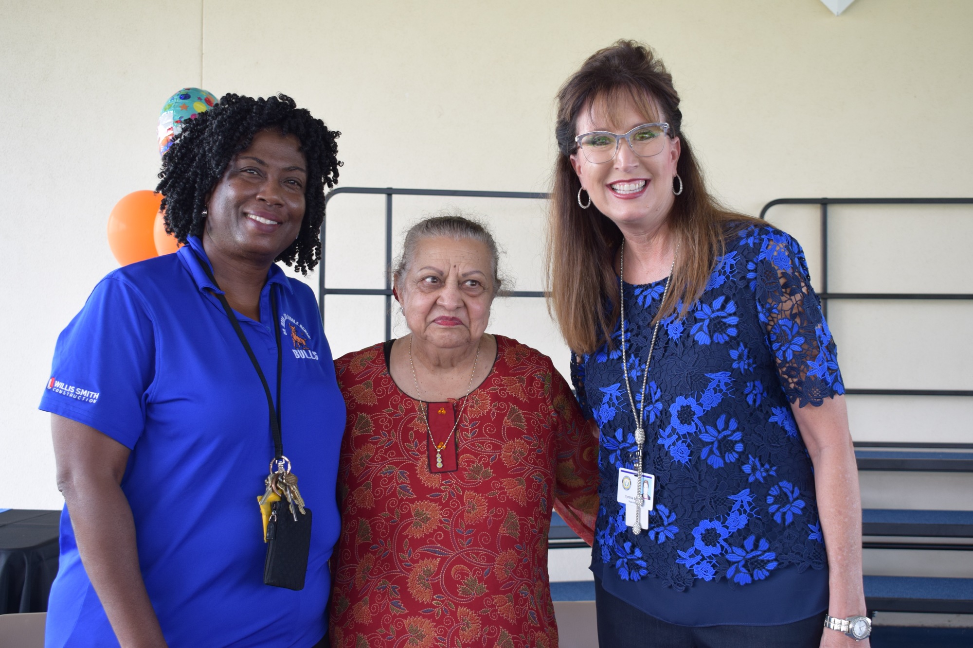 Angela Lindsey, the principal of Dr. Mona Jain Middle School, Mona Jain and Cynthia Saunders, superintendent of the School District of Manatee County, congratulate Mona Jain Middle students on their academic success. File photo.