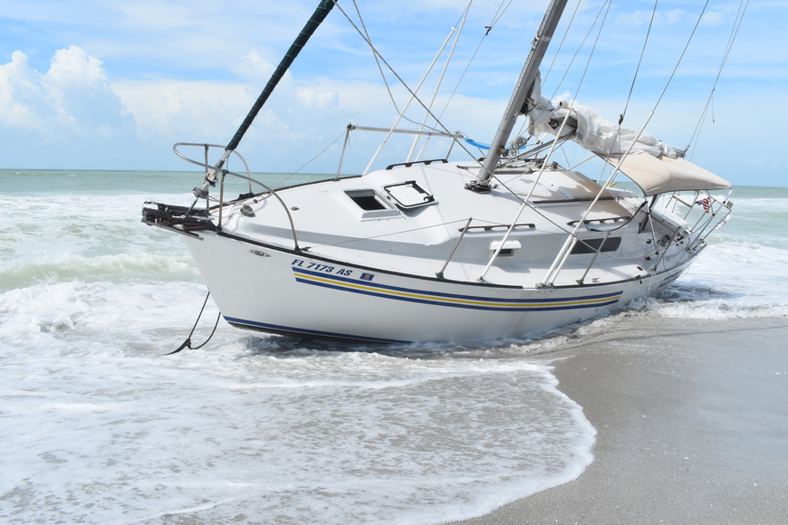 A sailboat was stranded on a Longboat beach from mid-September to when Tropical Storm Eta hit in November. File photo.