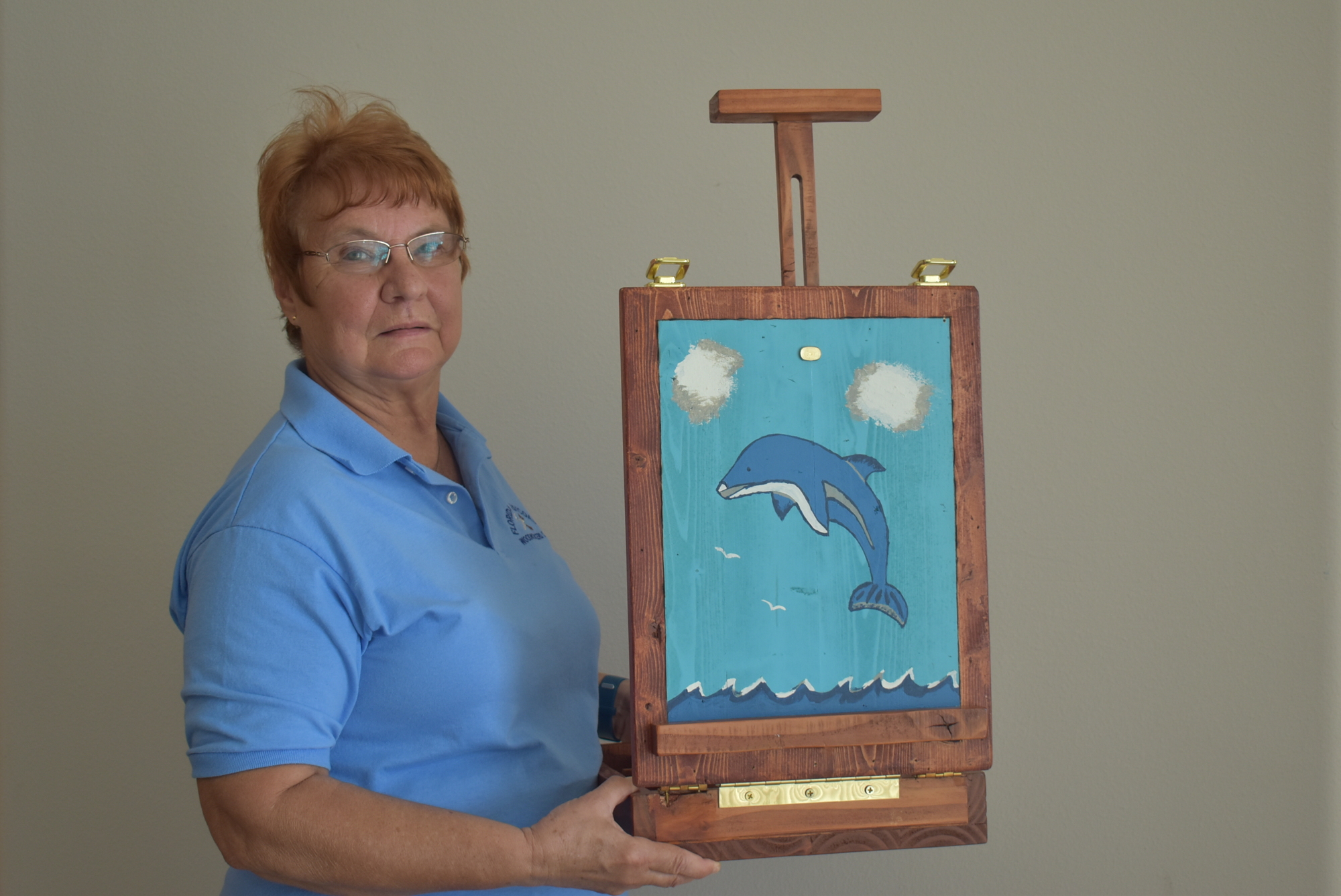 Whisper Bend resident Barbara Brown, who considers herself a novice, made this project from exactly one 2x4 piece of wood. It is an art supplies drawer with an easel cover and a painting of her own making.