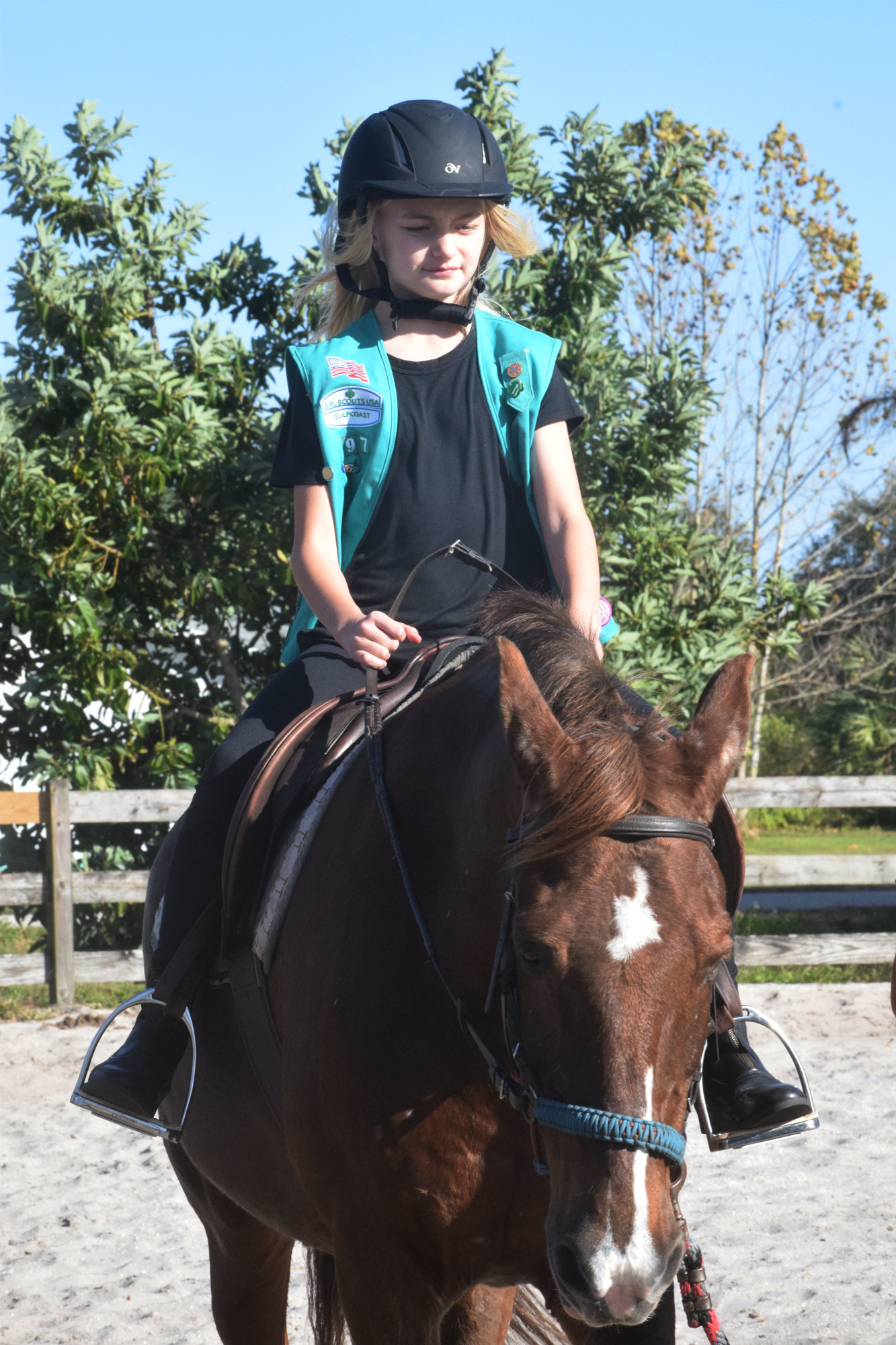 Jenna Jahn, a member of Girl Scout Troop 97, loves horseback riding and enjoyed sharing the experience with her fellow scouts. Photo by Liz Ramos.