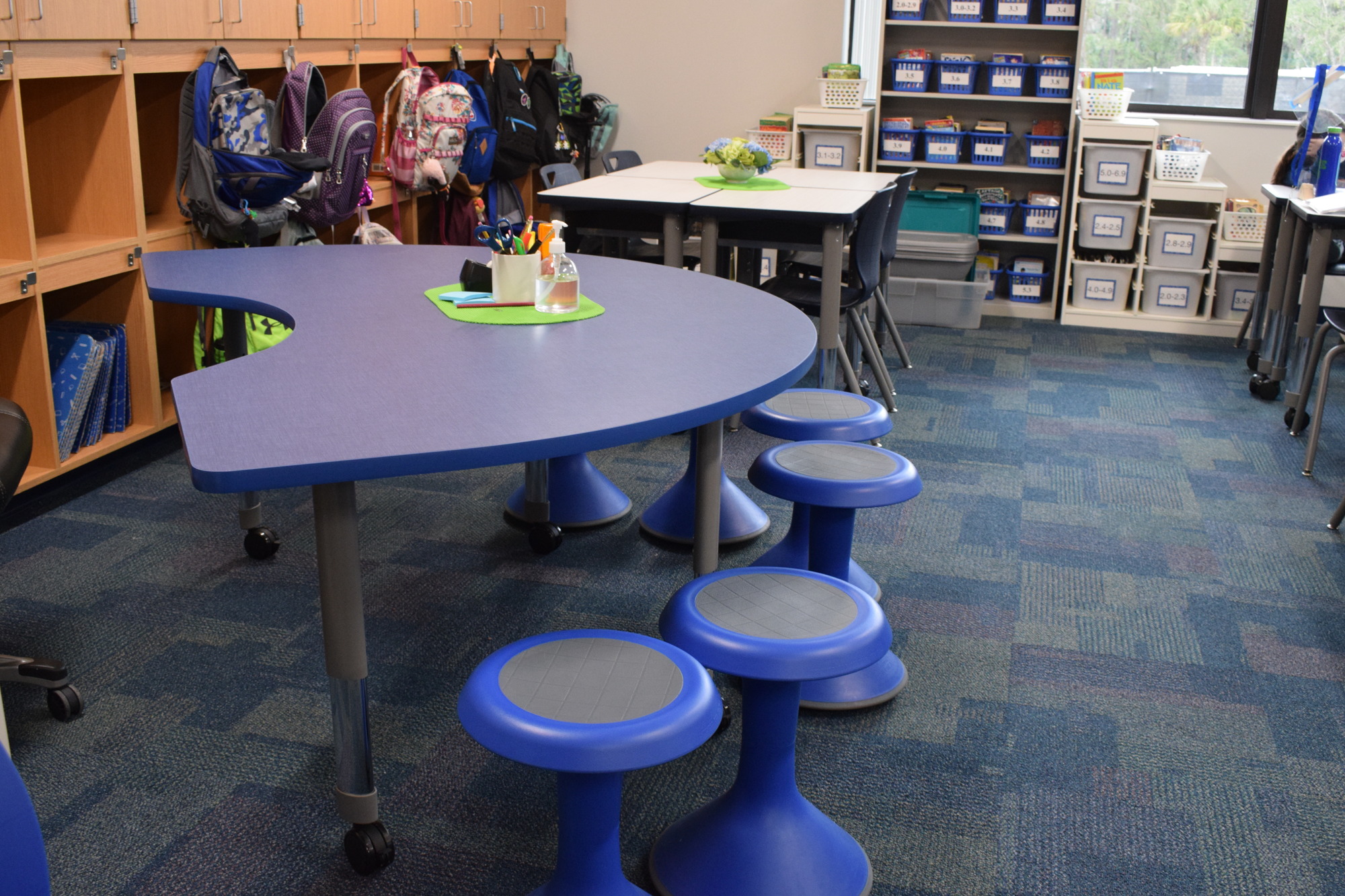 Students love to sit on the new wiggly stools in the additions.