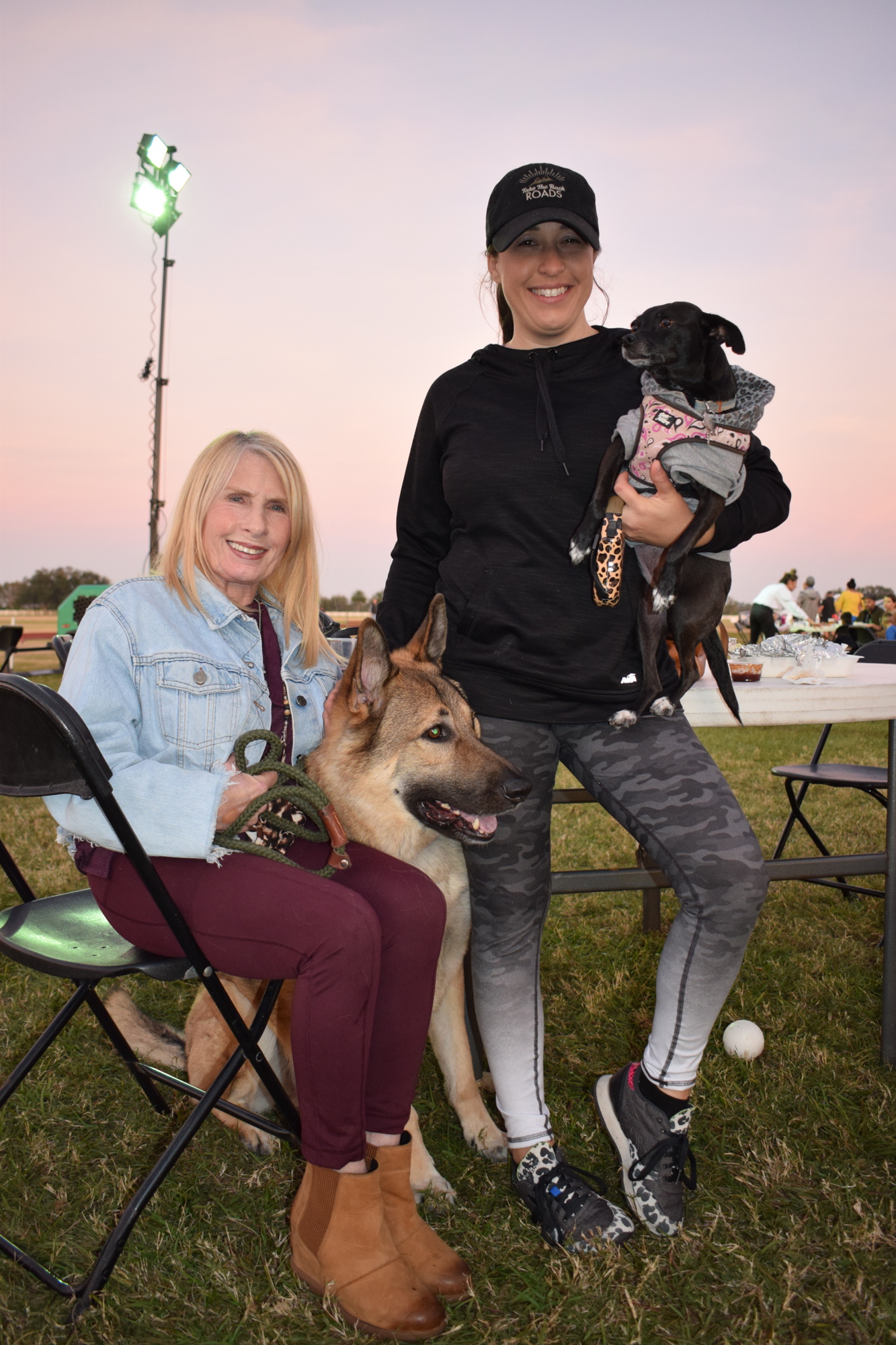 River Landing's Cindy Ernst and her daughter Falyn Ernst spend time with their dogs at Ranch Nite Wednesdays. Falyn Ernst would occasionally give her dogs a french fry.