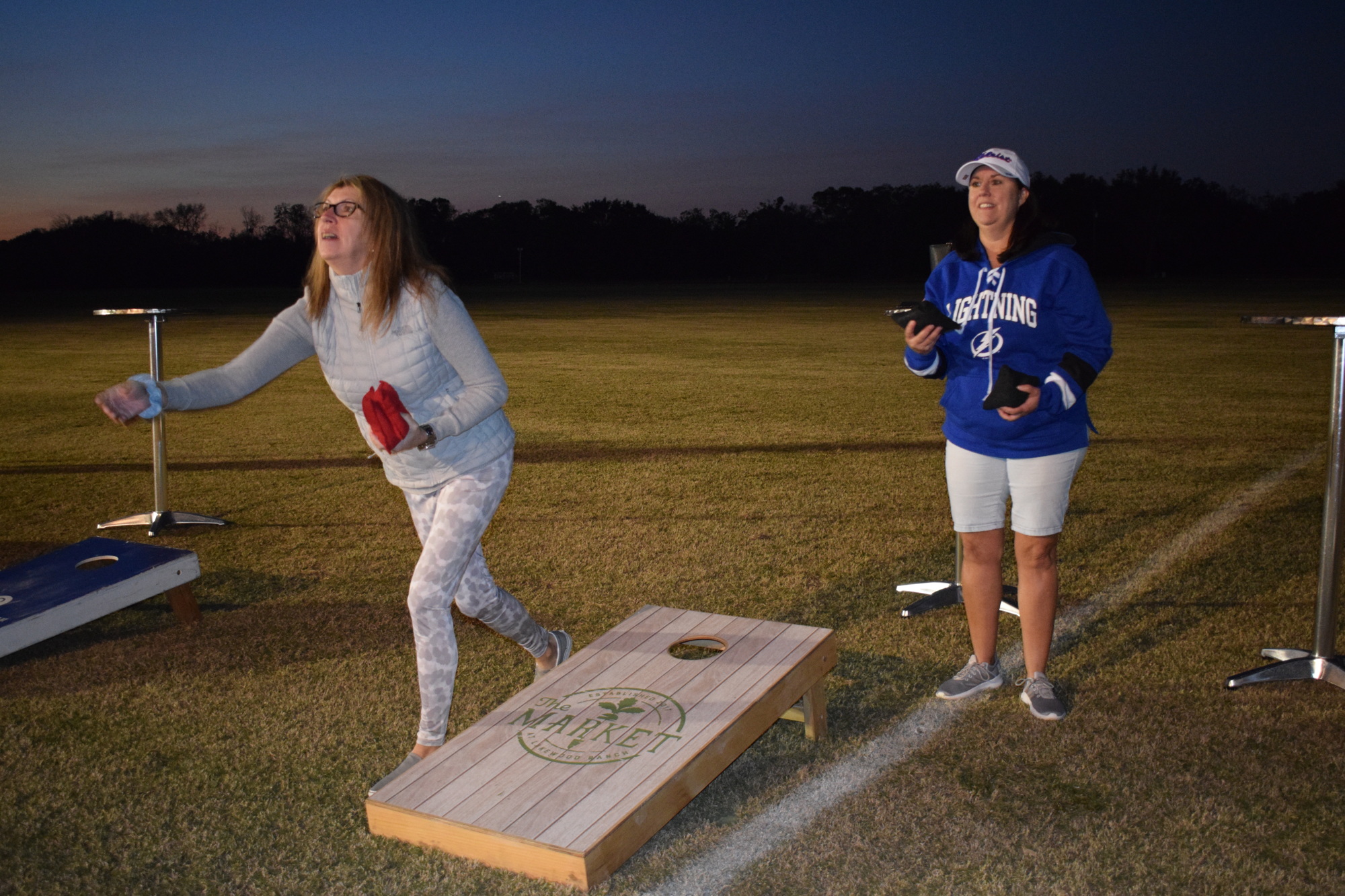 Indigo's Joanne Leger and Apollo Beach's Cynthia McGaha, who have been best friends for at least 20 years, have fun while playing cornhole.