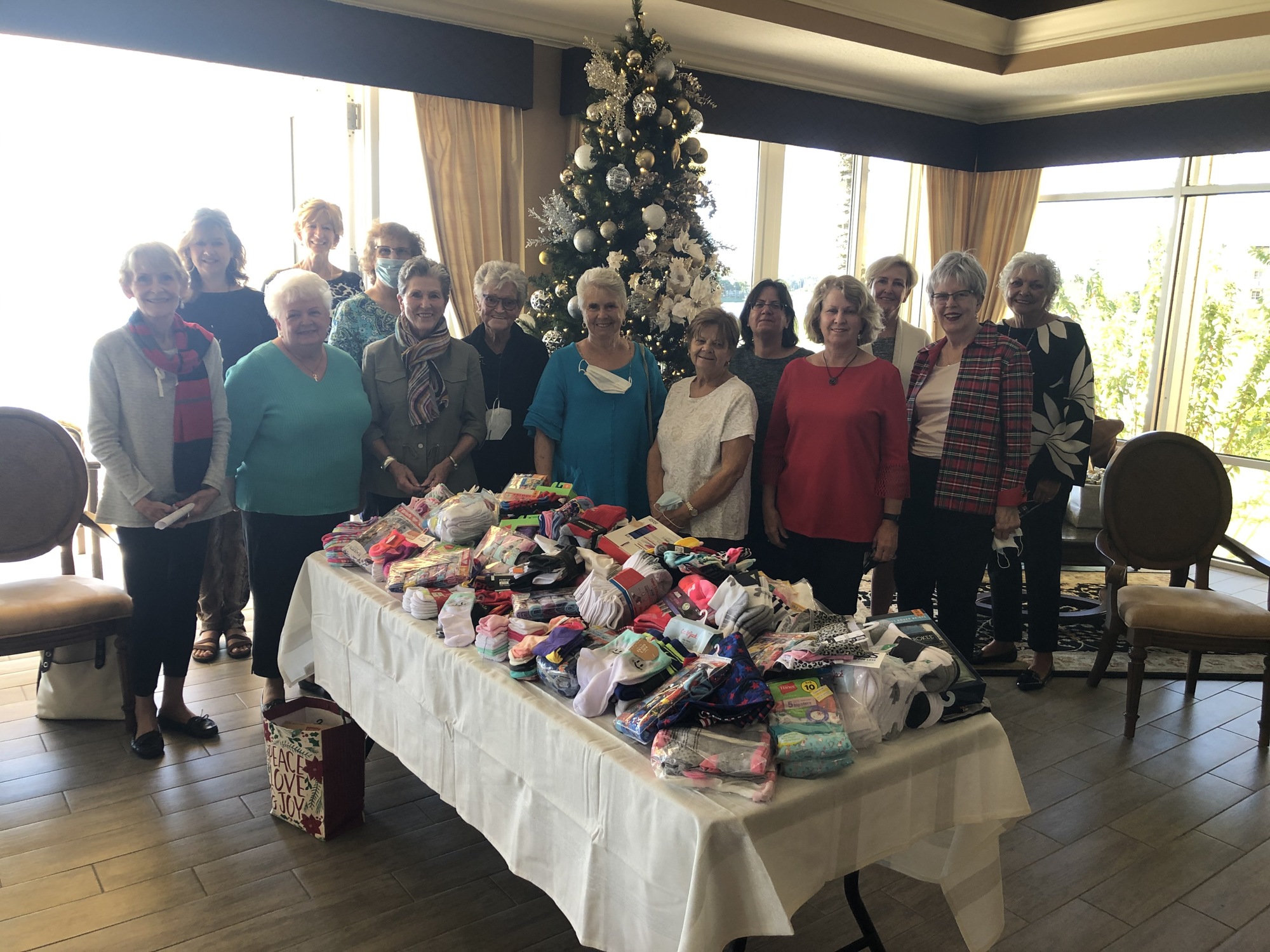 Members of Women of WaterCrest collect underwear and socks to donate to Mothers Helping Mothers for the group's Thanksgiving Project. Courtesy photo.