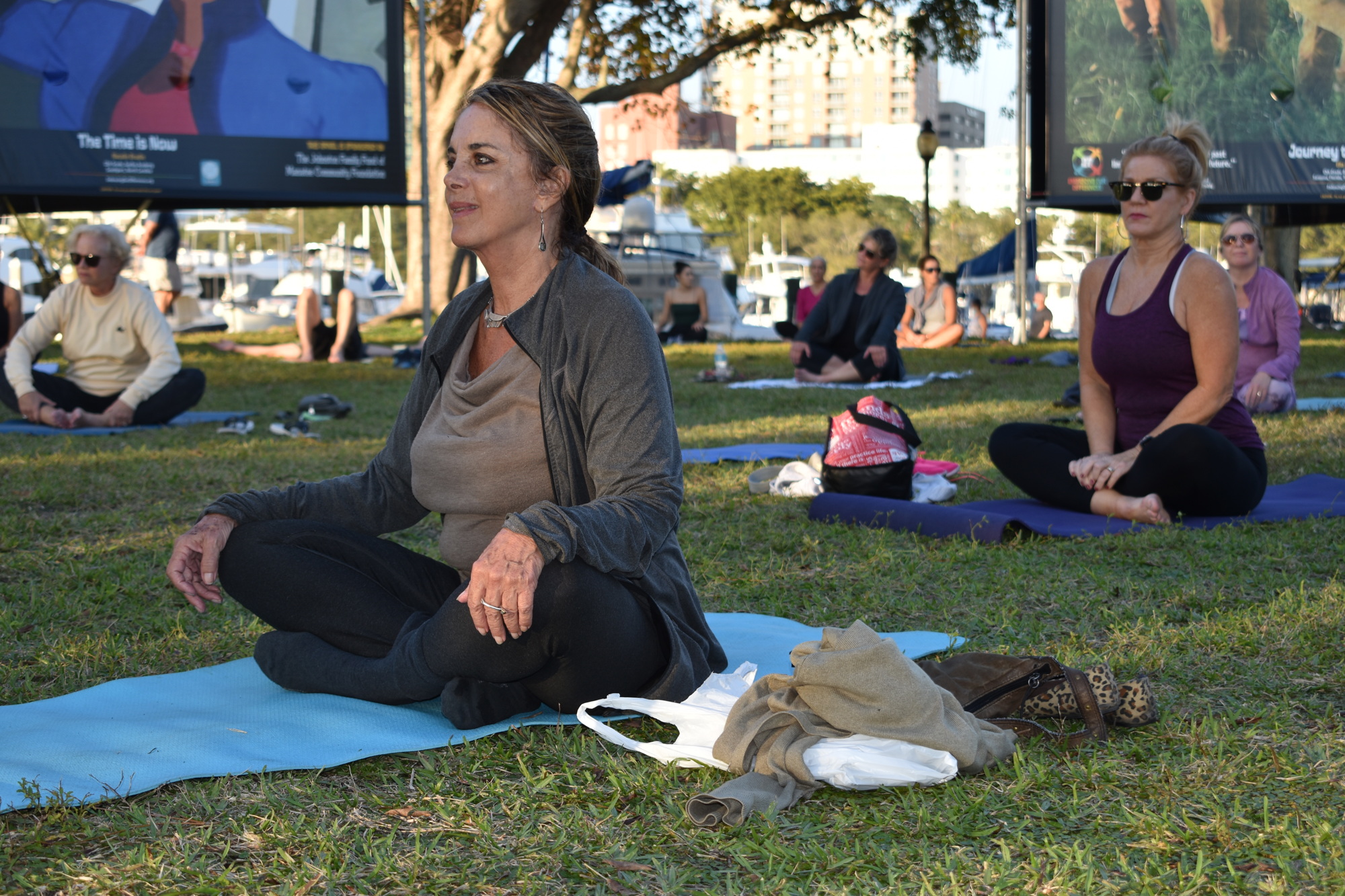 Ines Ebrenz (left) prepares for the yoga class Jan. 26 at Bayfront Park.