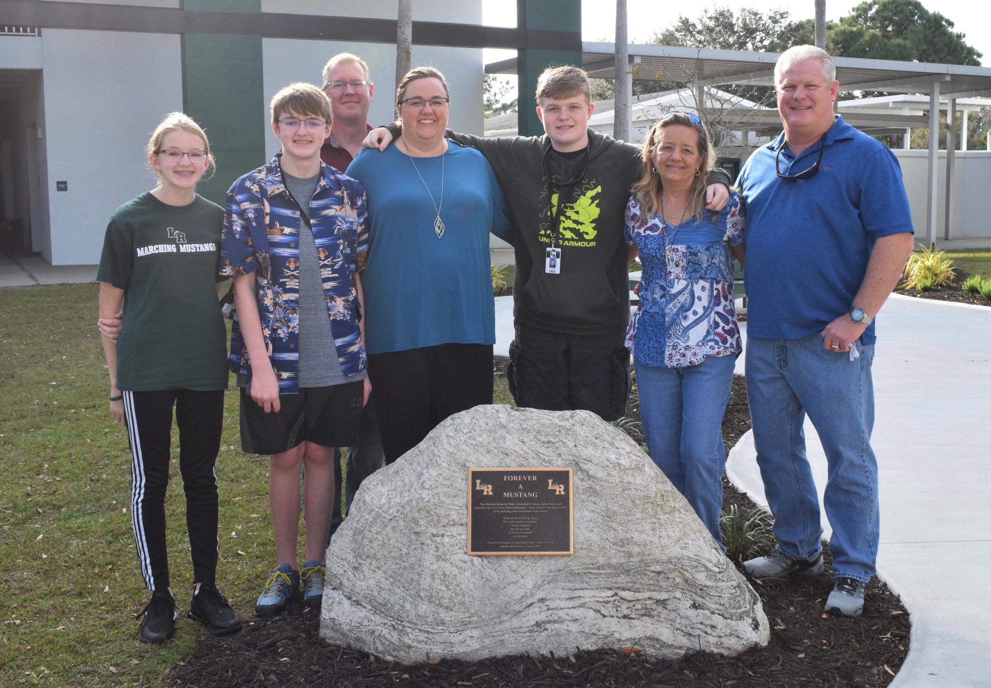 Katie Powers, Robert Powers, Dan Powers, Rebecca Powers, Cory Coyner, Shayleen Coyner and Scott Coyner have worked for nearly two years to make the Mustang Memorial Walk a reality for Lakewood Ranch High School students.