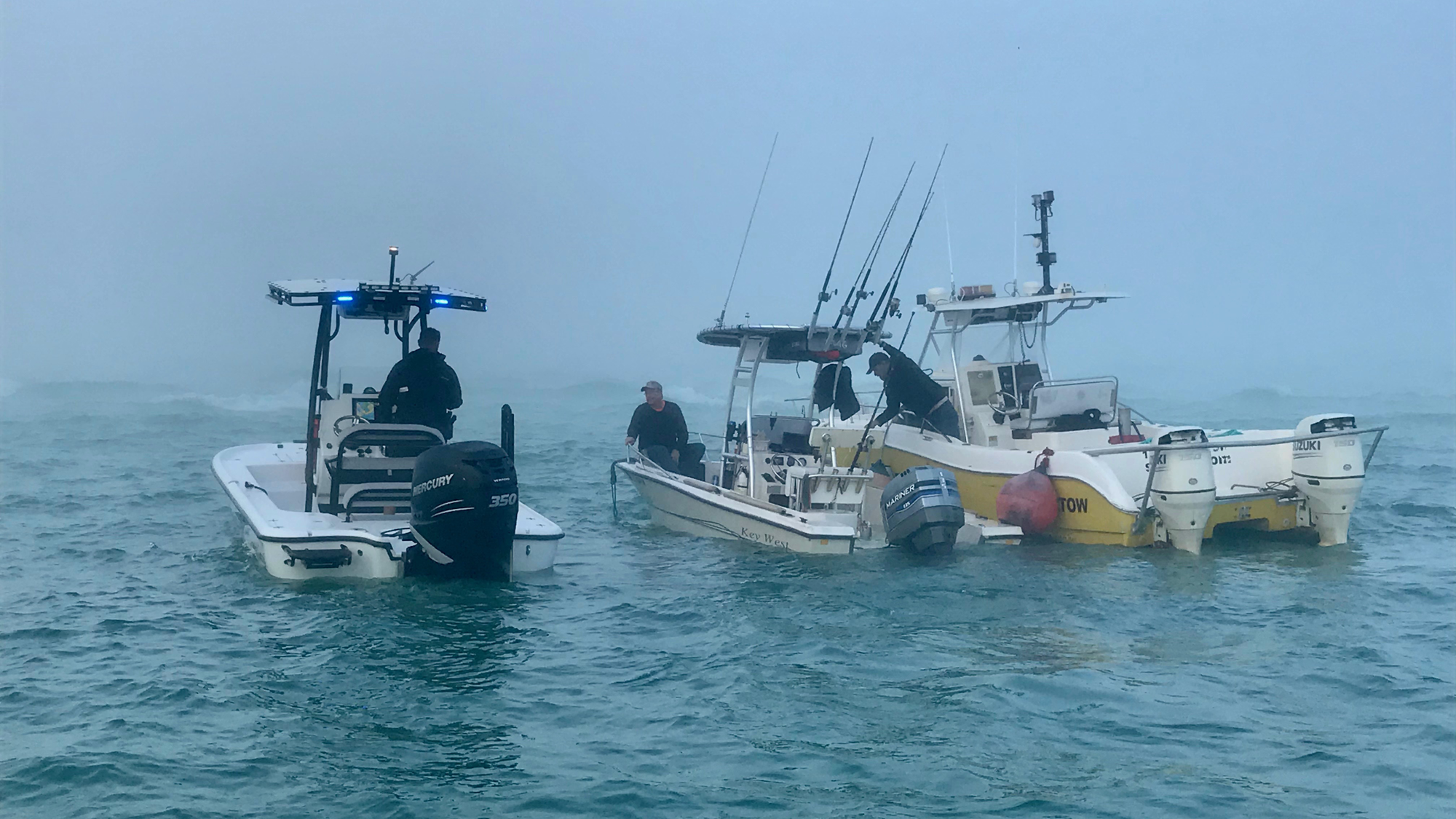 Sarasota Police Department marine officer Michael Skinner and Longboat Key marine patrol officer Joshua Connors helped rescue two people whose boat hit a sandbar on Jan. 23 near New Pass.