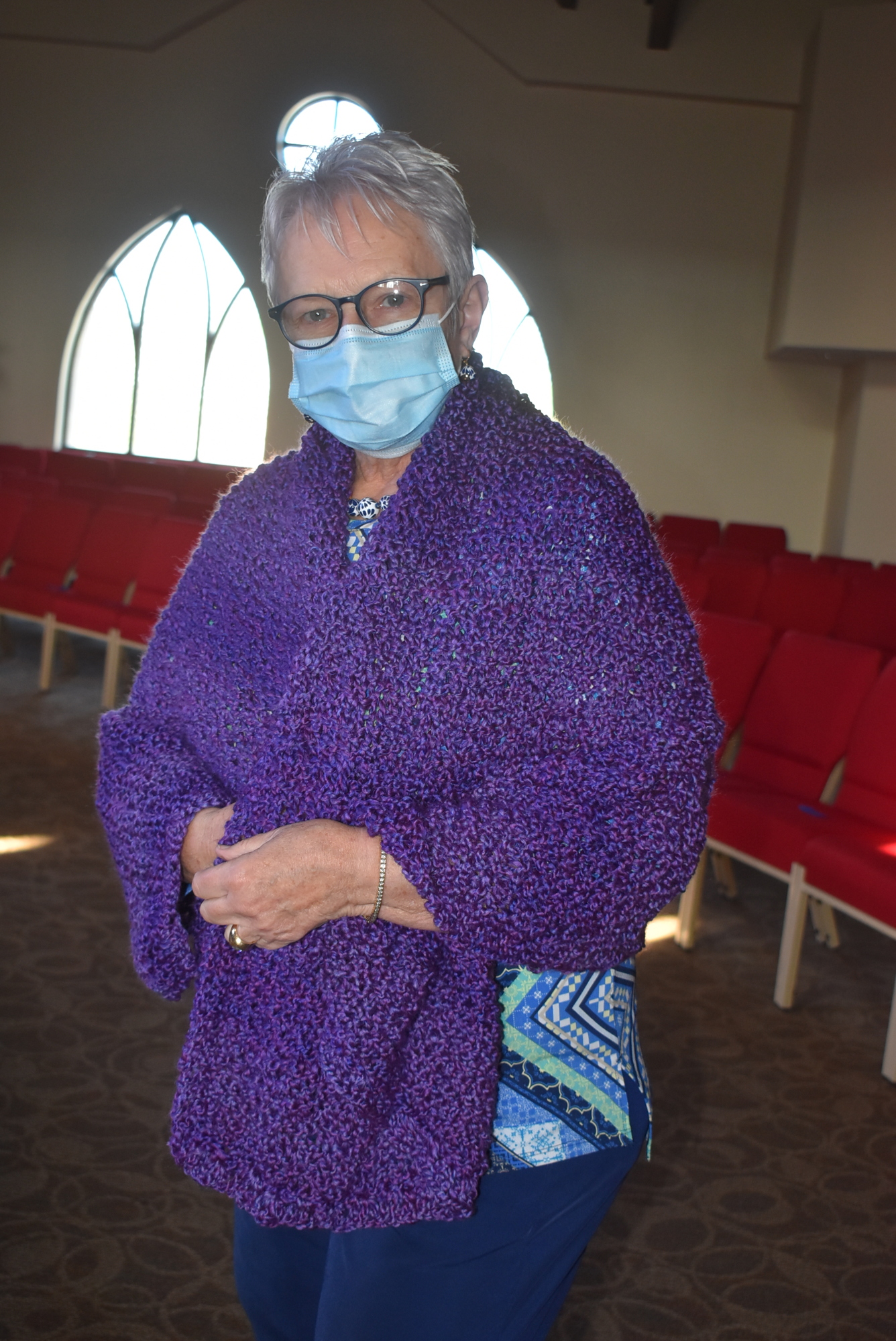 Holly Finks wears a prayer shawl.