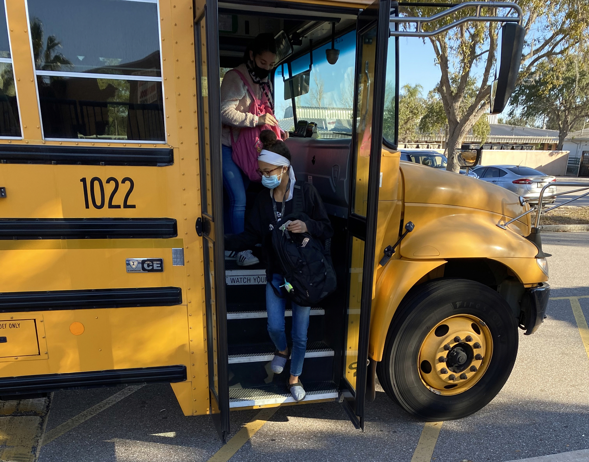 Braden River Middle School students head inside to start their day after taking the bus to school. The School District of Manatee County has 205 buses in its fleet and could be adding an electric bus. Courtesy photo.