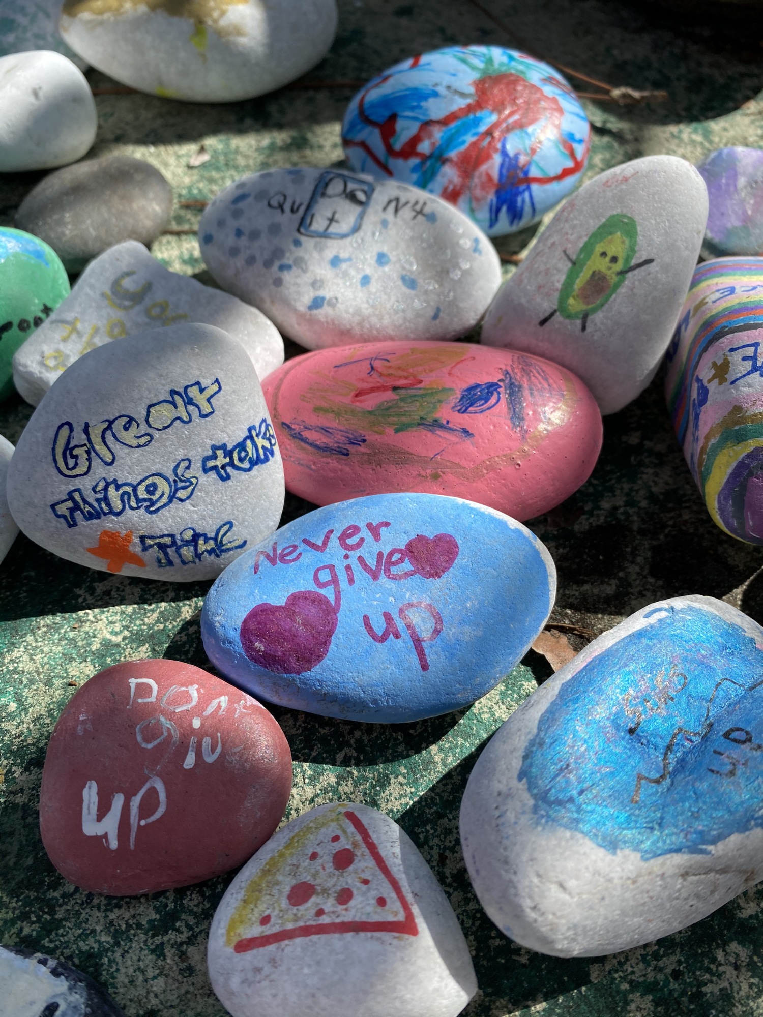 Some of the rocks have positive messages on them while others have pictures painted on them. Courtesy photo.
