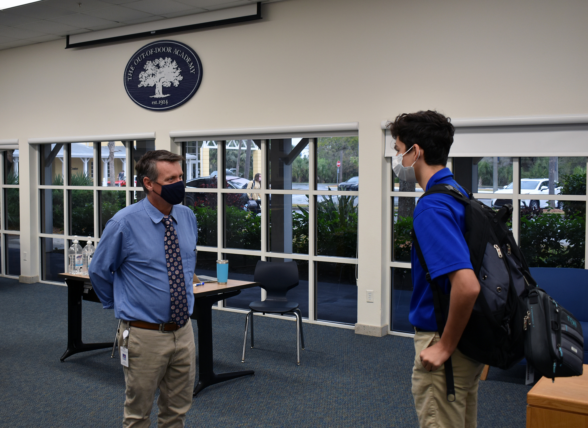 Every morning, Sean Ball, the head of upper school, chats with students like Joseph Clarke as they start the school day. Courtesy photo.