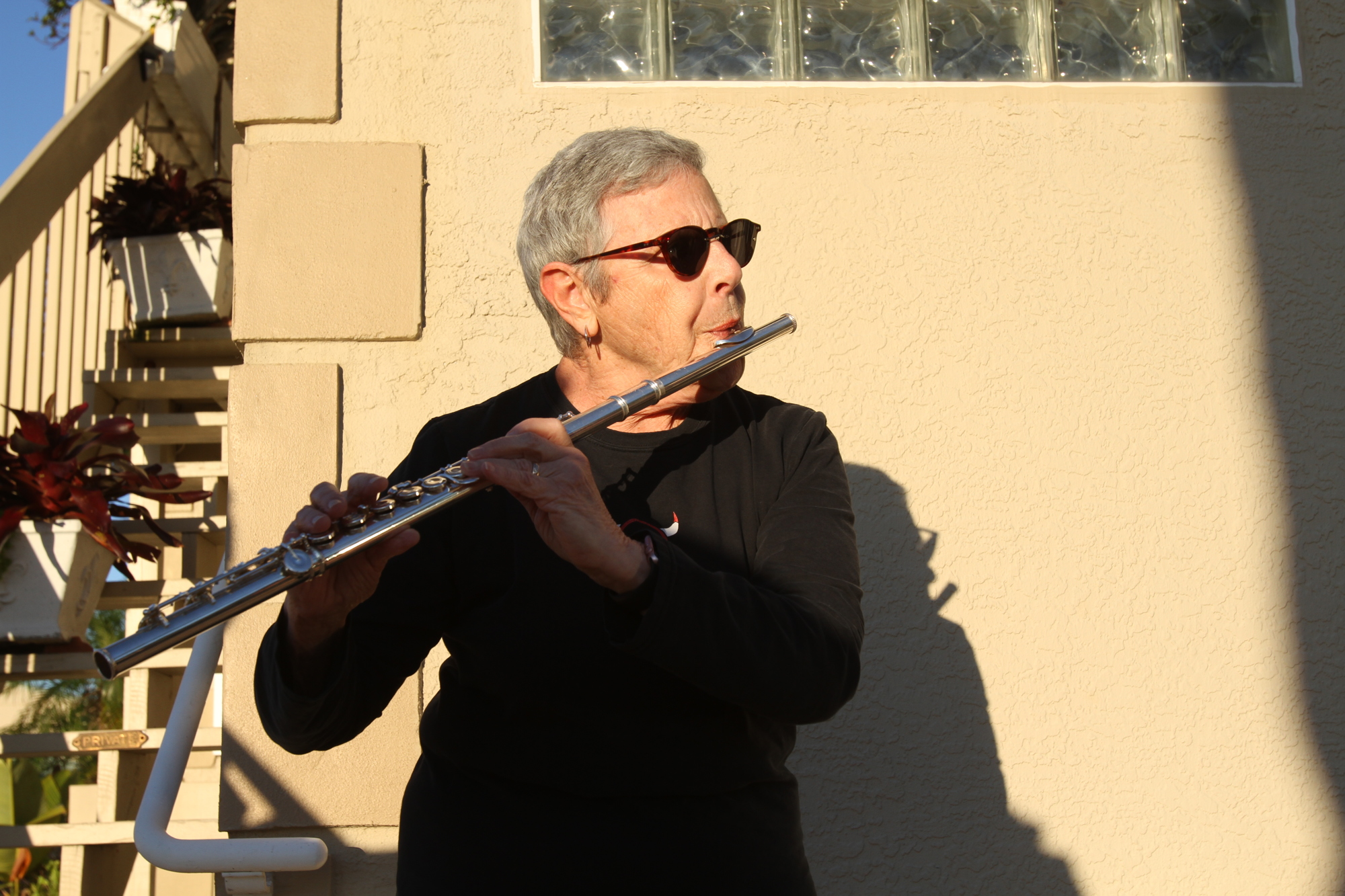 Cary Jacobs has adjusted well to playing flute solo and with a smaller number of people.