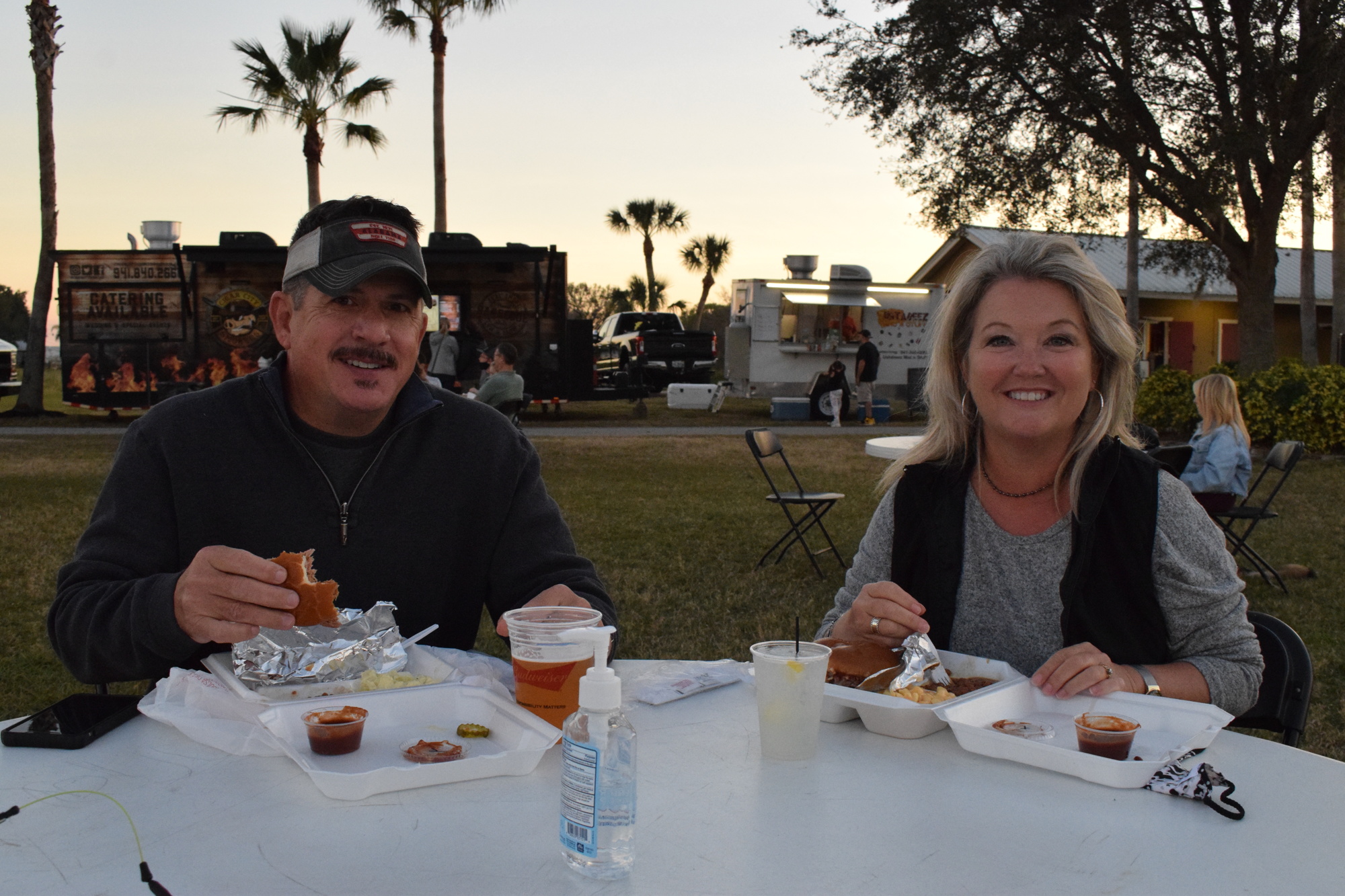 Greenbrook's Matt and Lisa Buck chow down on food from Cigar City Smokers during their first Ranch Nite Wednesdays. The food trucks at the event provide multiple options for people to indulge. File photo.