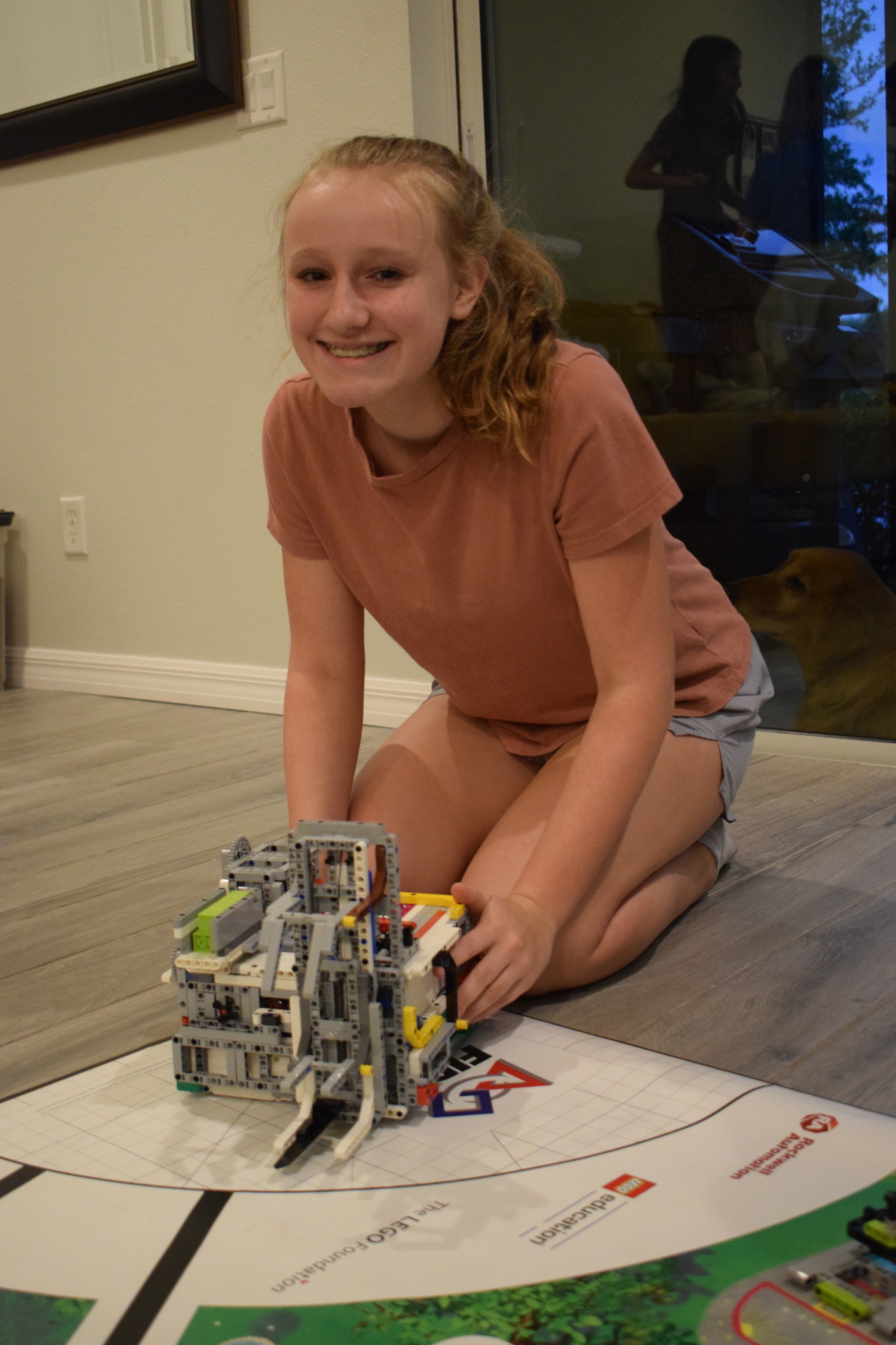 Tess Lippincott uses the robot to run a mission.