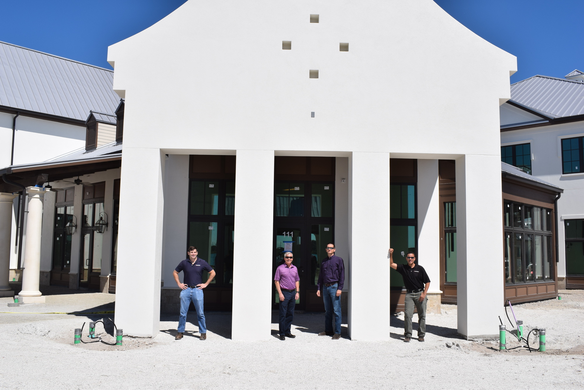 Co-project Manager Jeffrey Loffredo, President David Sessions, Vice President Nathan Carr and Project Manager Angel Ortiz stand in front of the future home of   Korê.