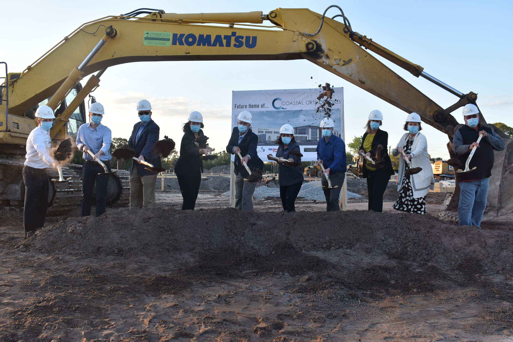 Coastal Orthopedics President Dr. Arthur Valadie, Coastal Orthopedics CEO Paige LeMay, local government officials and representatives from BBL Construction Services and Somerset CPAs and Advisors participate in the groundbreaking.