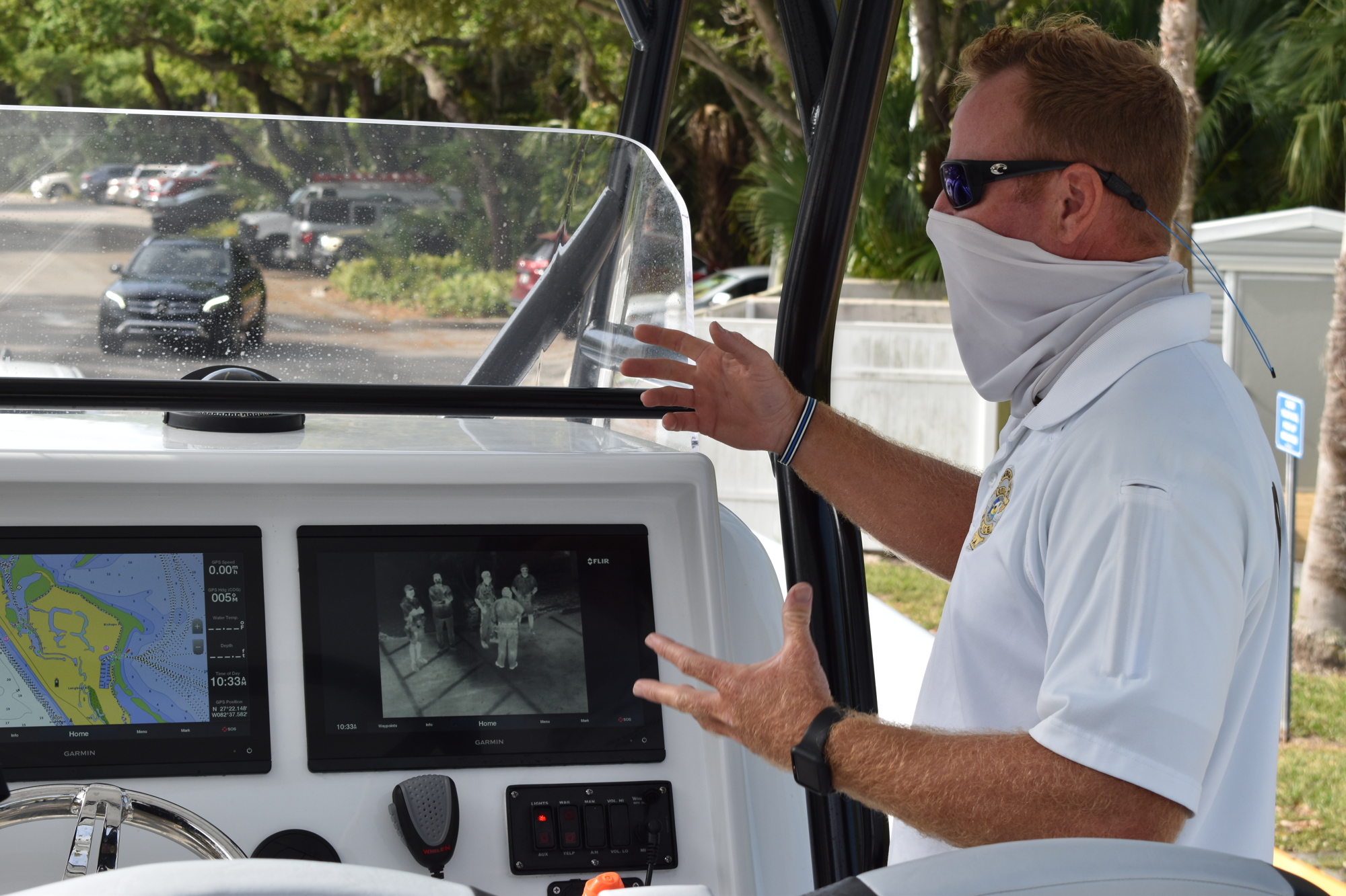 Marine patrol officer Joshua Connors demonstrates how the two Garmin displays are used on the police department's new boat.