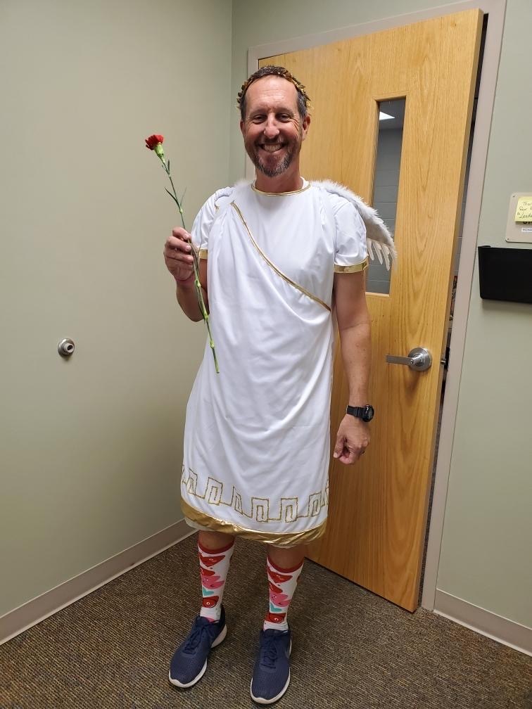 Principal Todd Richardson dresses as Cupid to deliver flowers and chocolate to his staff to show his appreciation on Valentine's Day in 2020. File photo.
