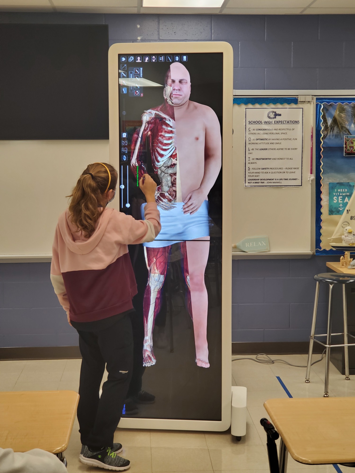 Alexa Dzuibek, a student at R. Dan Nolan Middle School, uses an anatomage table to dissect the layers of the body. The district uses funding from the 1-mill property tax increase to purchase the anatomage table. Courtesy photo.