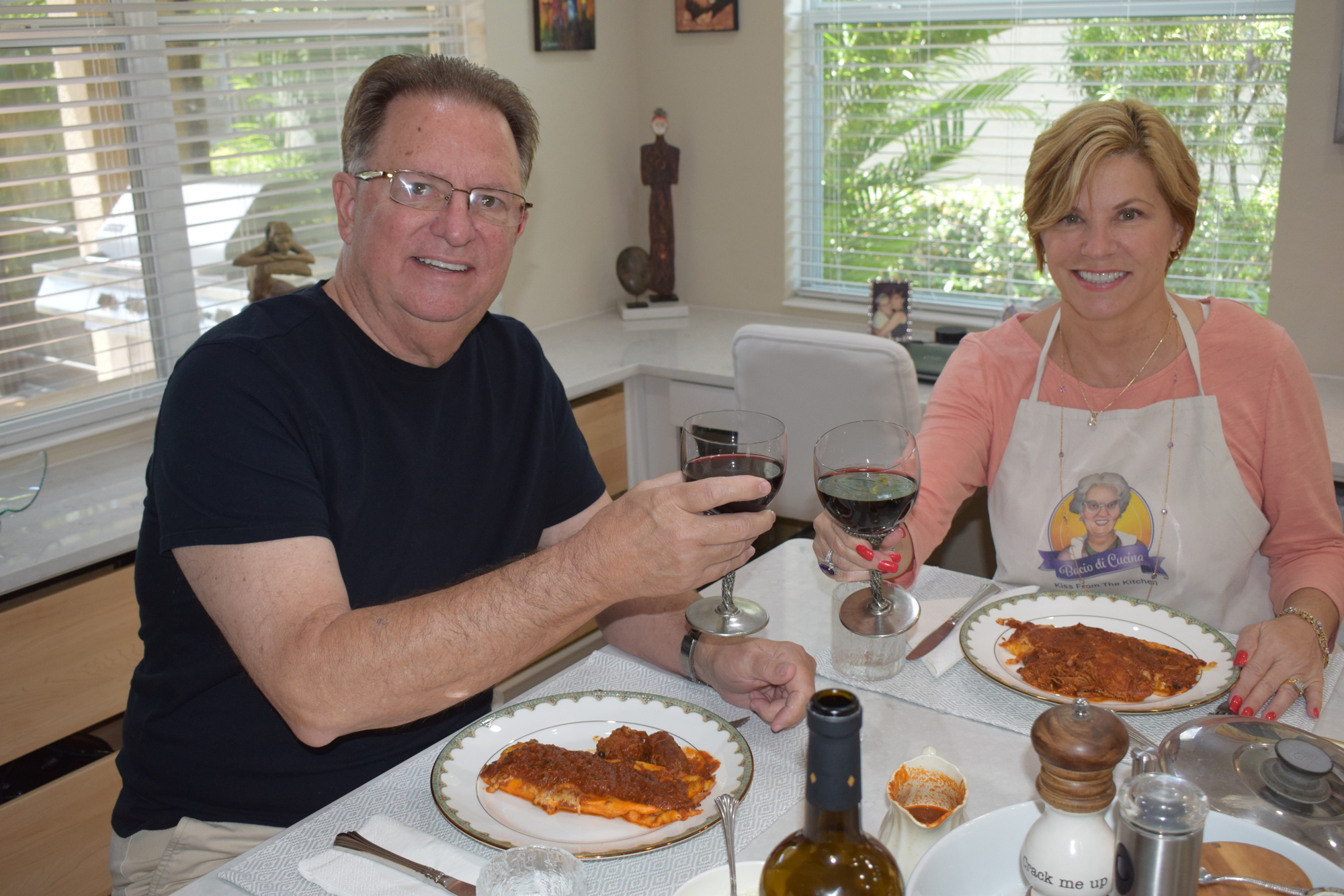 John Fain and Angela Massaro-Fain enjoy her manicotti at their Central Park home.