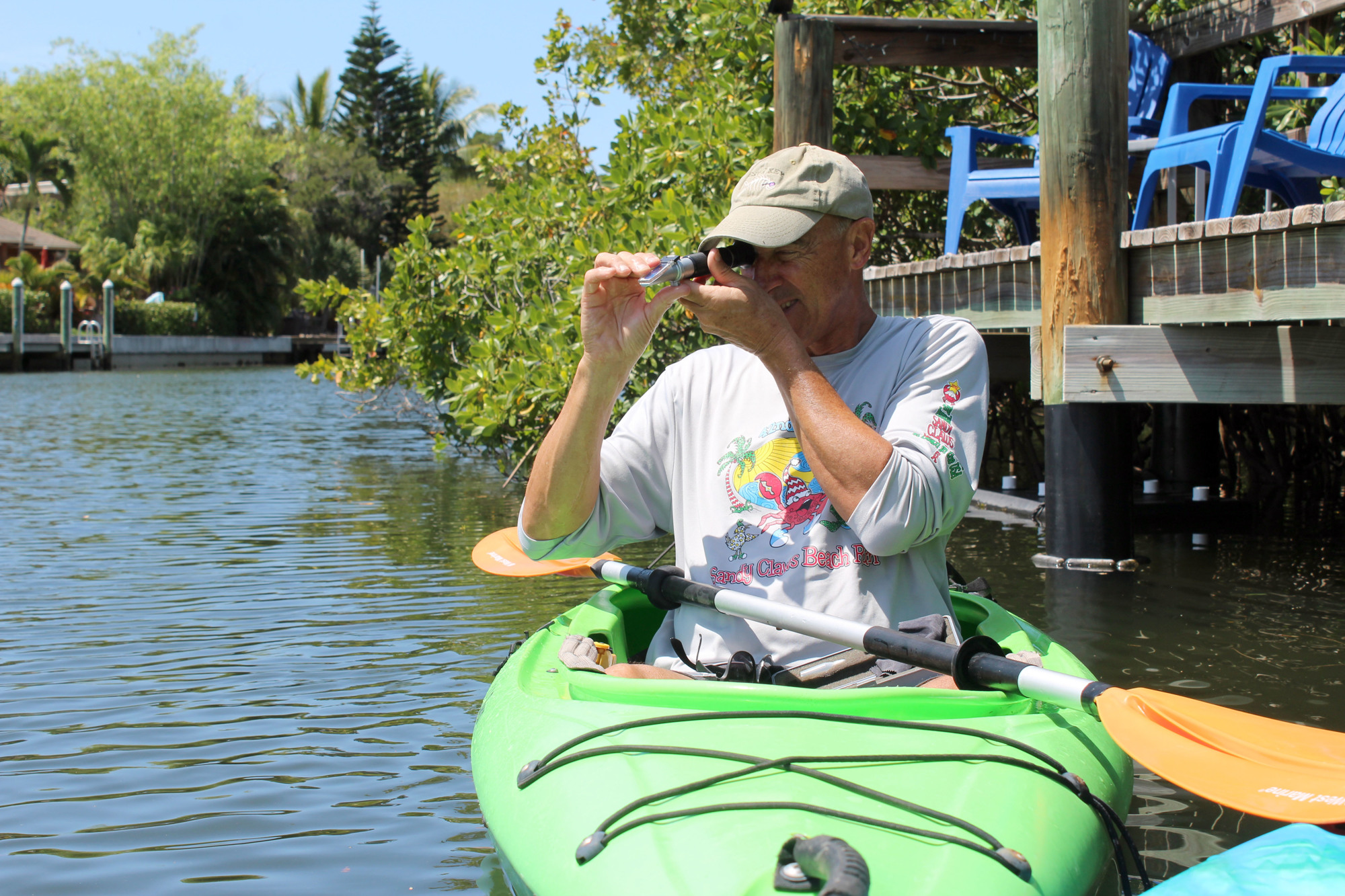 David Vozzolo uses a device to test the salinity of the water.