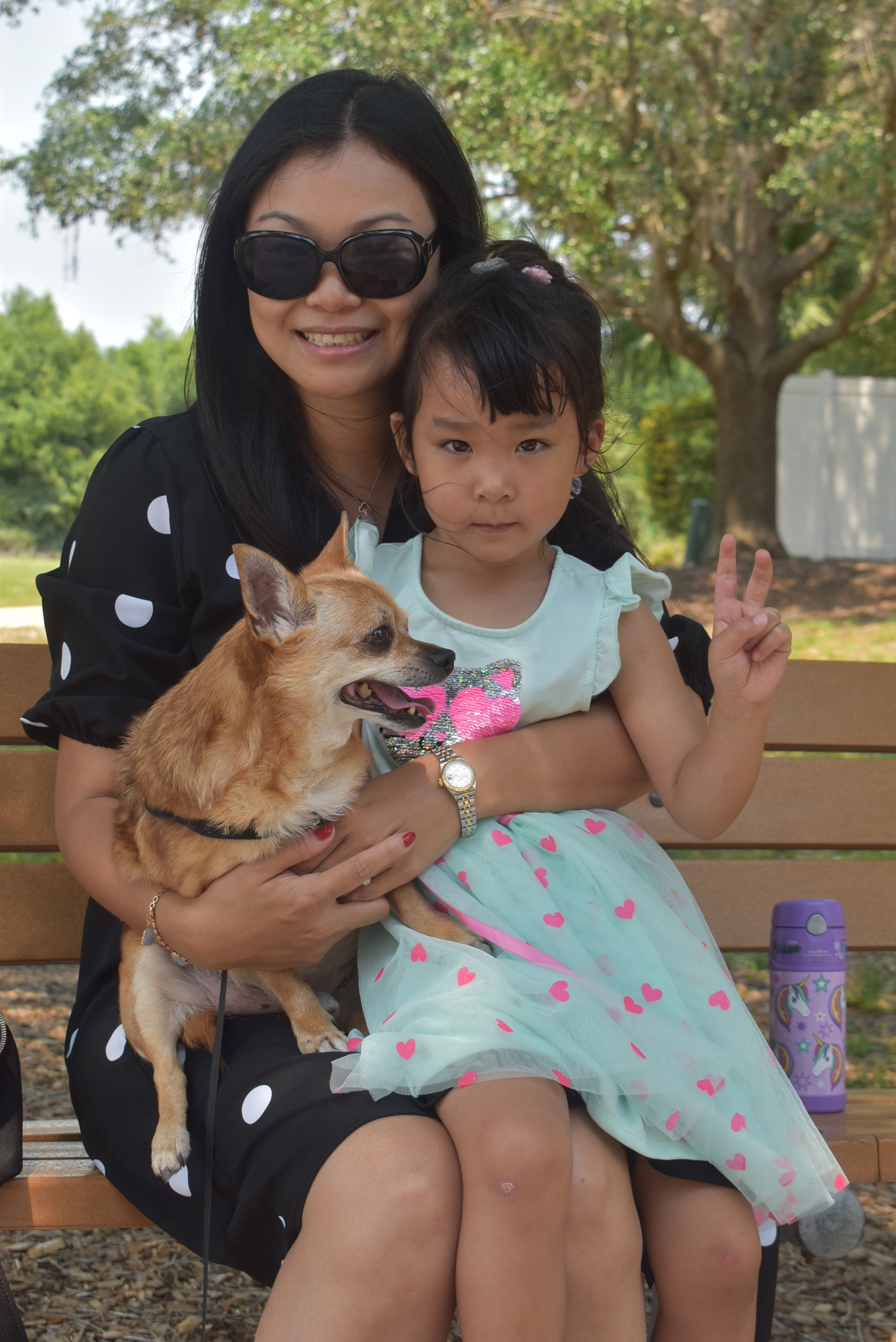The pandemic has given River Club's Sherry Yu a lot more time to teach Mandarin to her 4-year-old daughter, Fanya Yu, pictured with 15-year-old chihuahua mix Barbie.